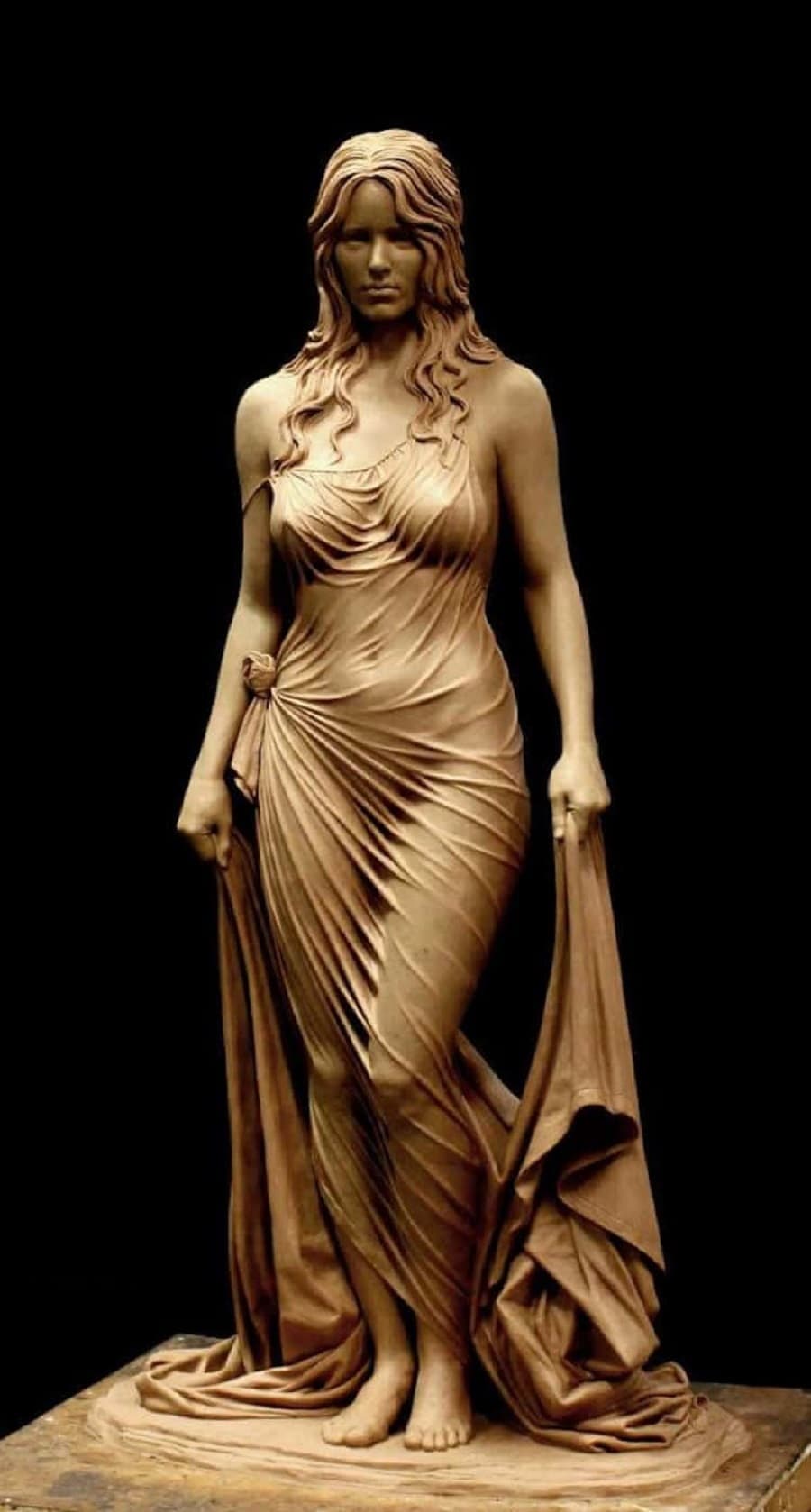 A clay sculpture of a young woman with long wavy hair in a clinging wet garment, holding a long towel that pools at her feet — Benjamin Victor, Bathsheba