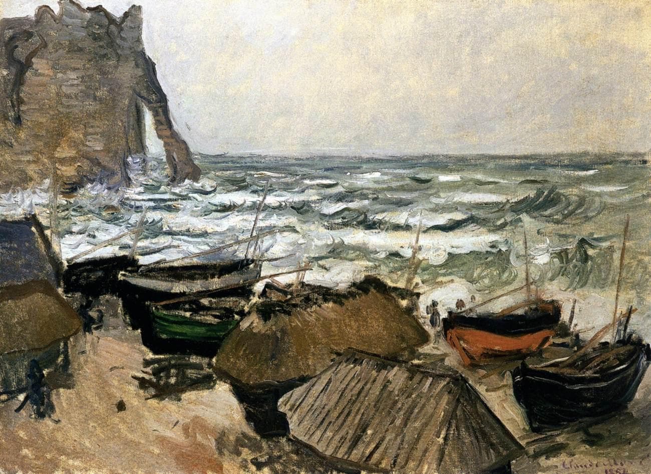Fishing boats and thatched boat-sheds on a pebble beach in front of breaking grey-green waves, with a chalk arch at upper left — Claude Monet, Fishing Boats, 1884