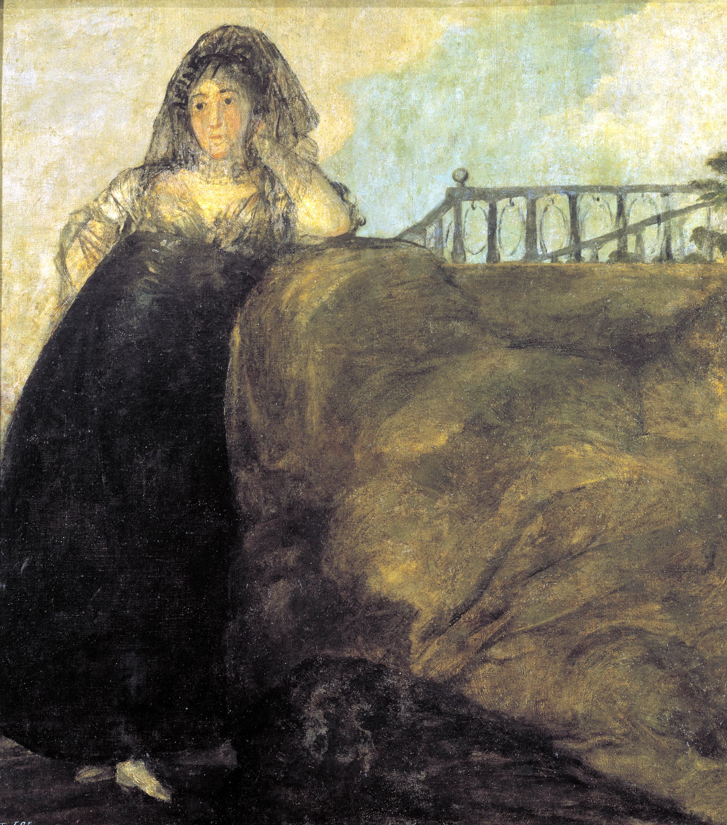 A woman in a black dress and lace mantilla leans her head on her hand against a large earth mound topped by an iron railing — Francisco Goya, La Leocadia, c. 1819–1823