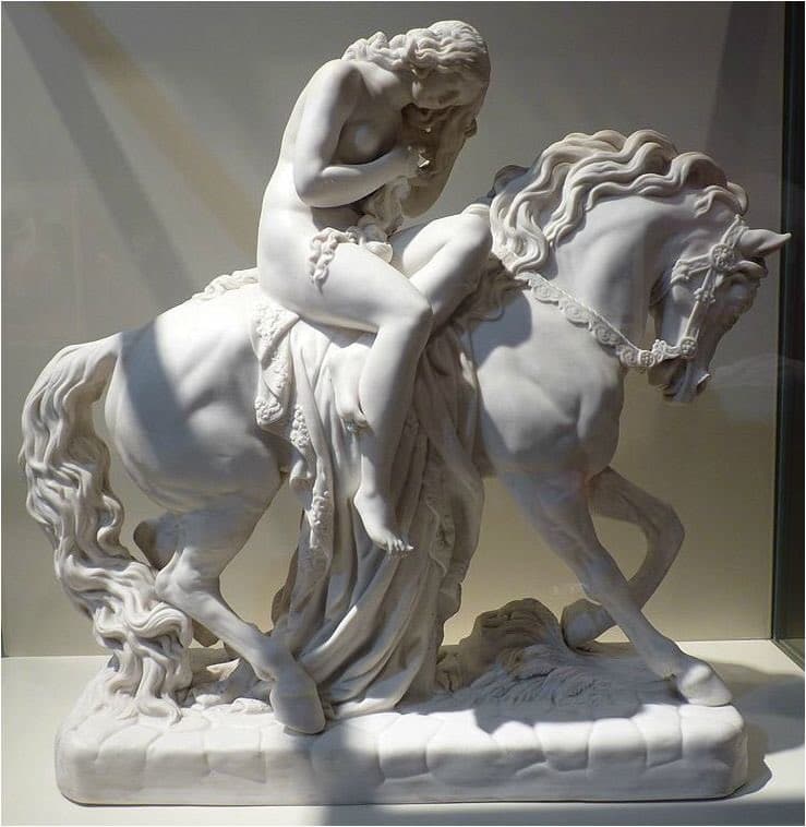 A white figure of a naked young woman riding side-saddle on a stepping horse, head bowed and hand covering her face, long hair falling forward, a flowered cloth draped over the horse — after John Thomas, Lady Godiva, 1861