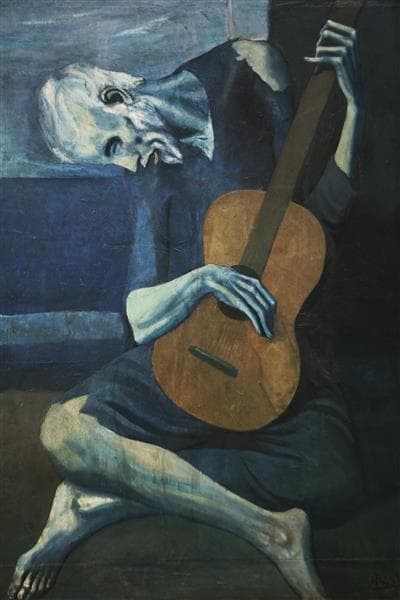 A gaunt, blind old man in ragged blue clothes sits hunched cross-legged over a brown guitar against a blue background — Pablo Picasso, The Old Guitarist, 1903–04