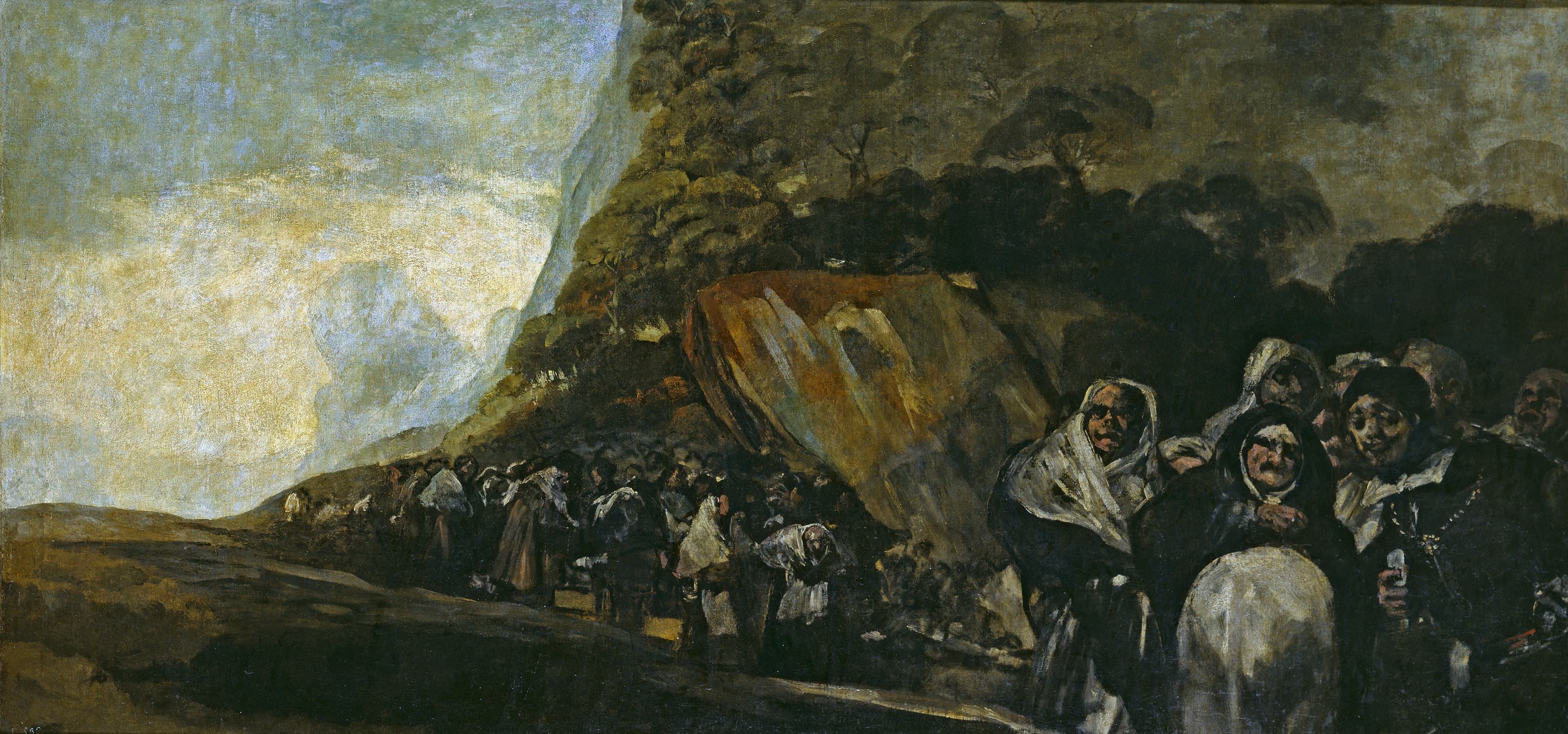 A cluster of staring figures in white headscarves and dark clothes stands at the foot of a huge dark hill as a procession winds away to the left — Francisco Goya, The Holy Office (Pilgrimage to the Fountain of San Isidro), c. 1819–1823