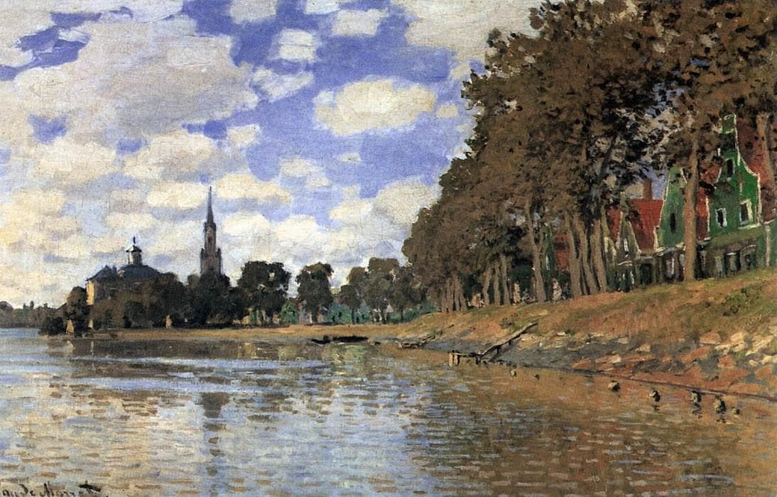 Green wooden houses with red roofs stand under tall trees on a river bank, with a church spire across the water under a cloudy blue sky — Claude Monet, Zaandam, 1871
