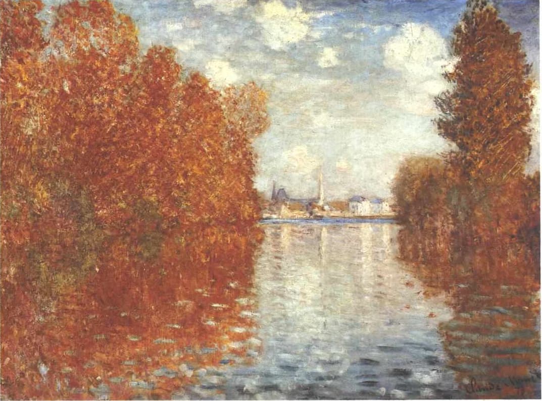 Masses of orange and red autumn trees frame a pale blue river reflecting their color, with white houses and a spire in the distance — Claude Monet, Autumn Effect at Argenteuil, 1873