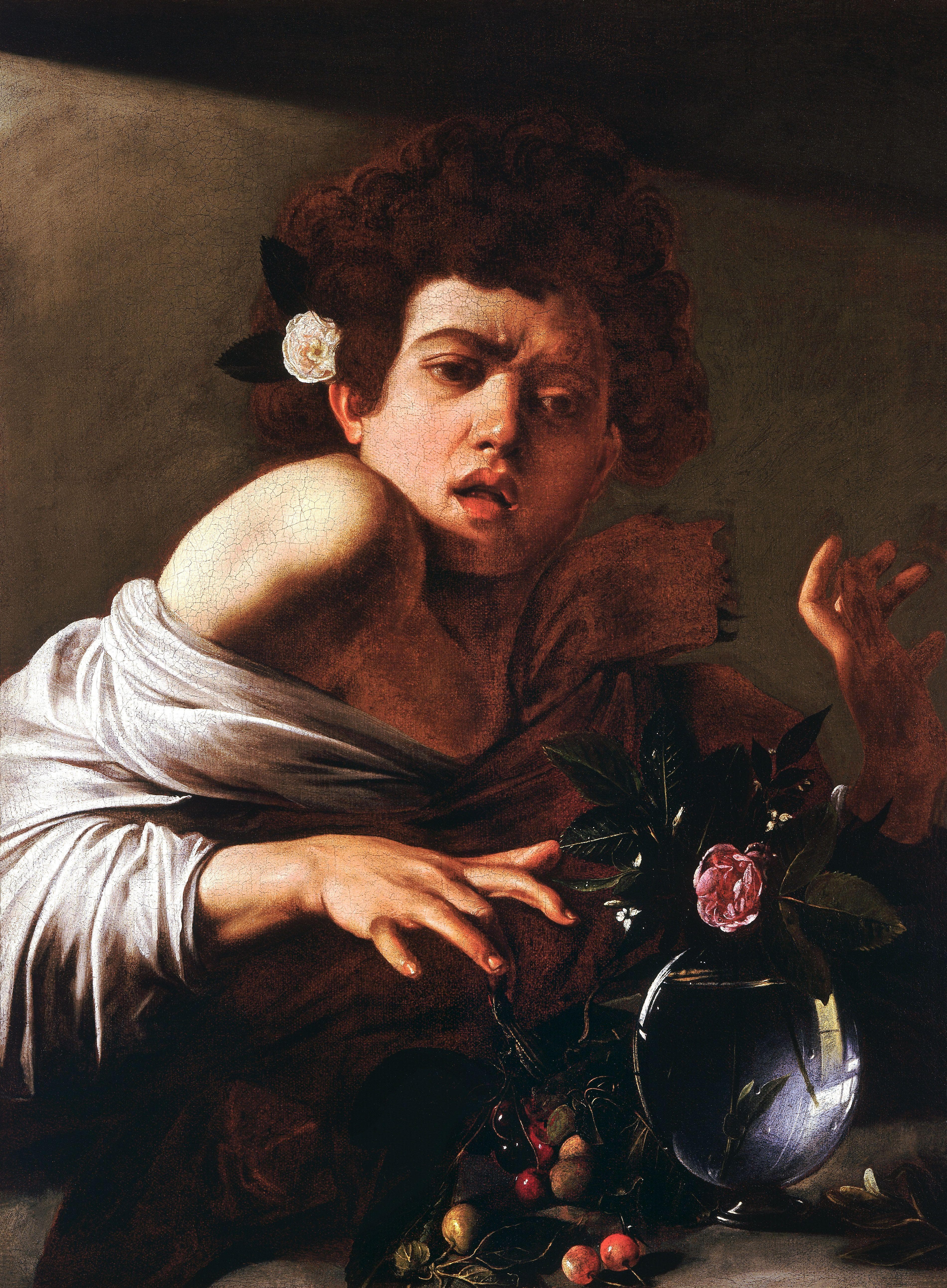 A startled youth with a rose behind his ear jerks his hand back as a lizard bites his finger beside a glass vase with a pink rose — Caravaggio, Boy Bitten by a Lizard, c. 1594–95