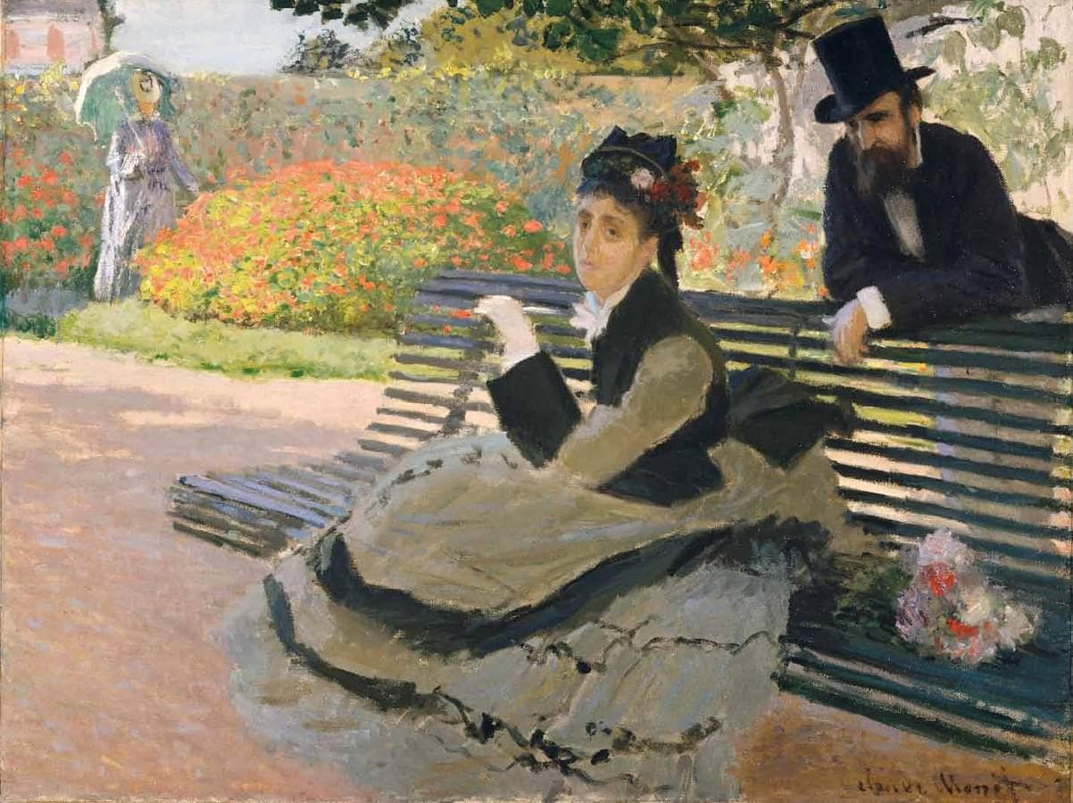 A woman in a grey-green skirt and black jacket sits on a green garden bench holding a note, a top-hatted bearded man leaning behind her, red geraniums beyond — Claude Monet, Camille Monet on a Garden Bench, 1873