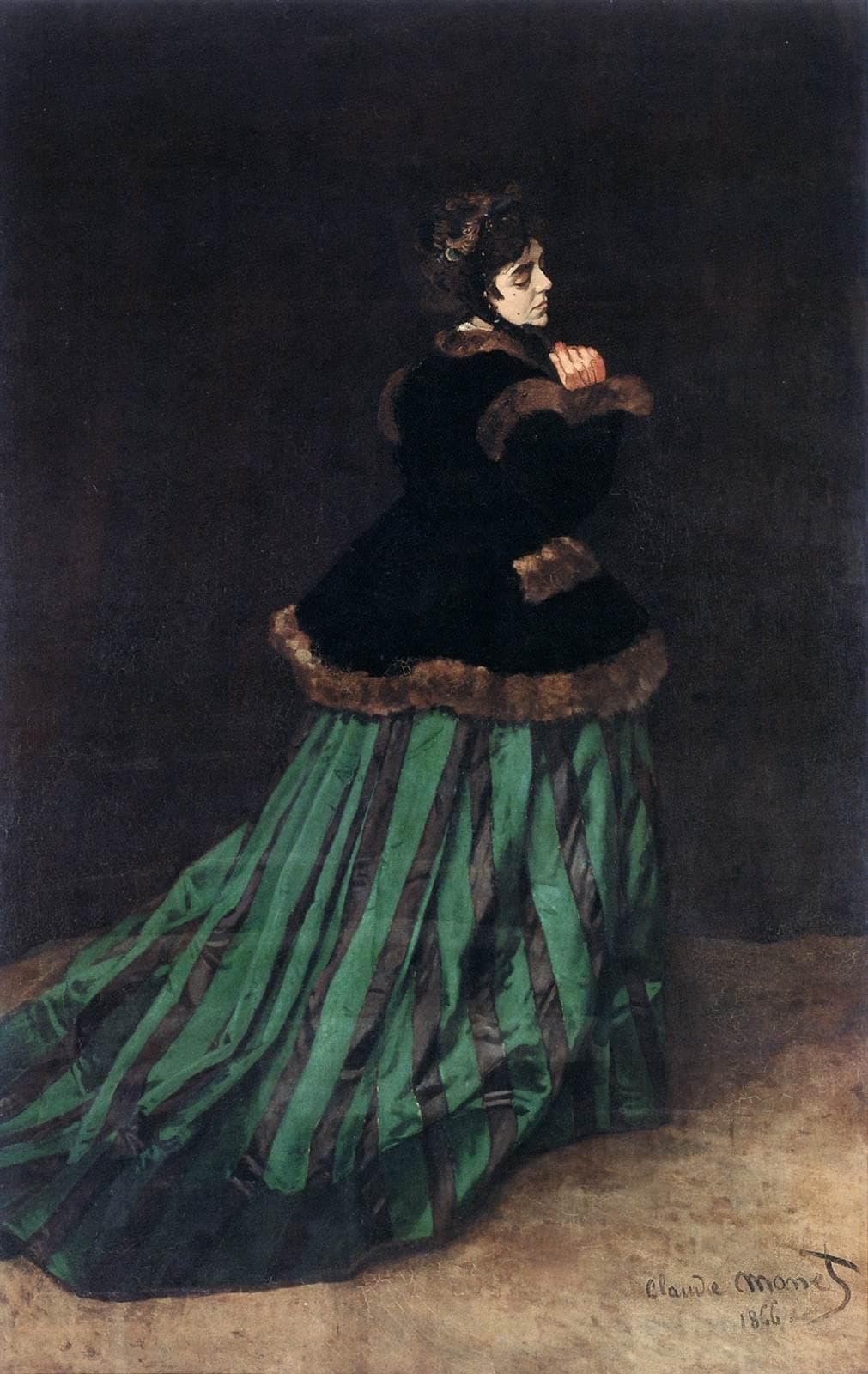A woman in a black fur-trimmed jacket and a long green-and-black striped silk dress turns her head over her shoulder against a dark background — Claude Monet, Camille (The Woman in the Green Dress), 1866