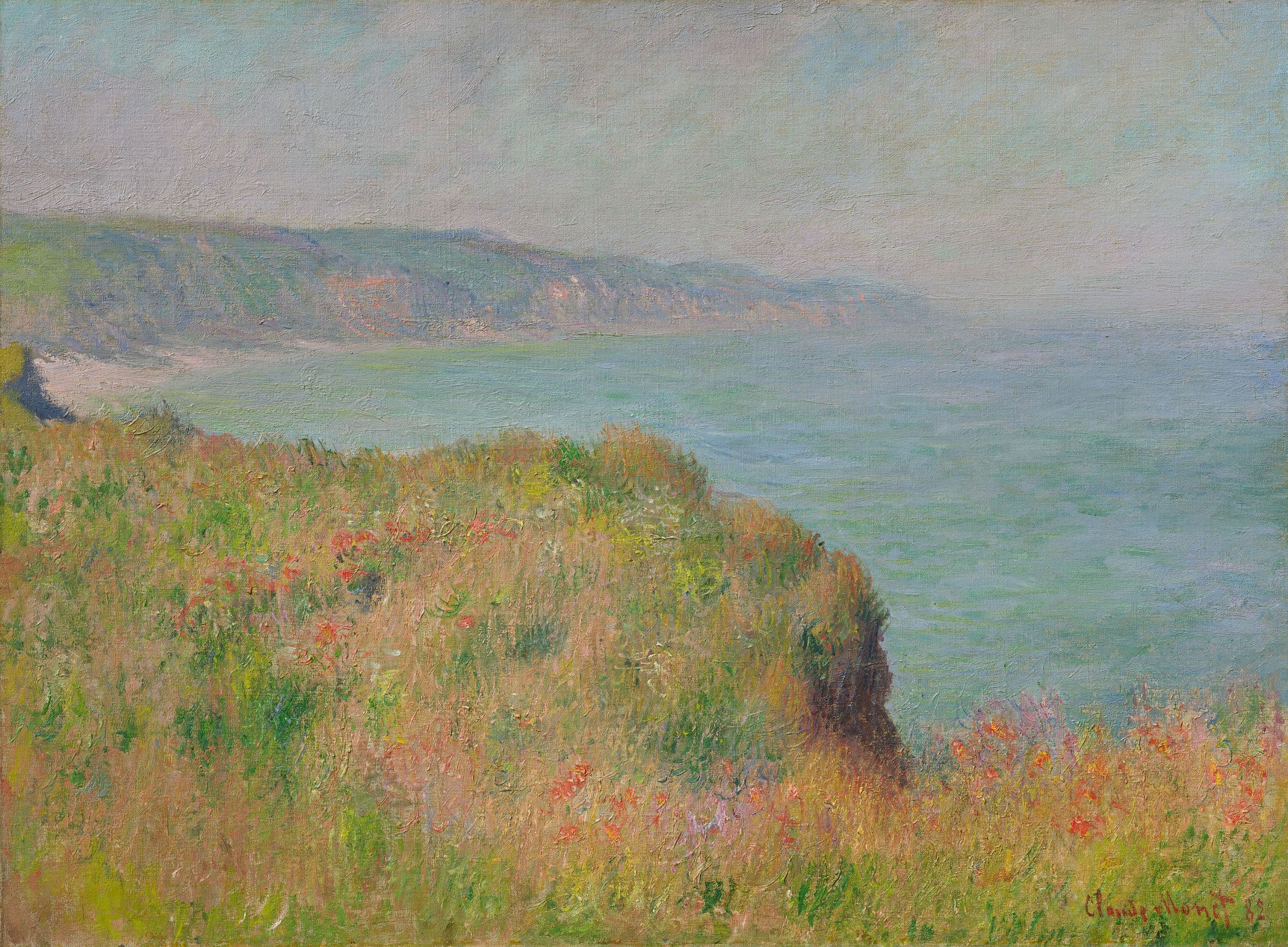 A grassy clifftop dotted with red poppies ends abruptly above a calm, hazy green sea, distant cliffs across the bay — Claude Monet, Edge of the Cliff at Pourville, 1882