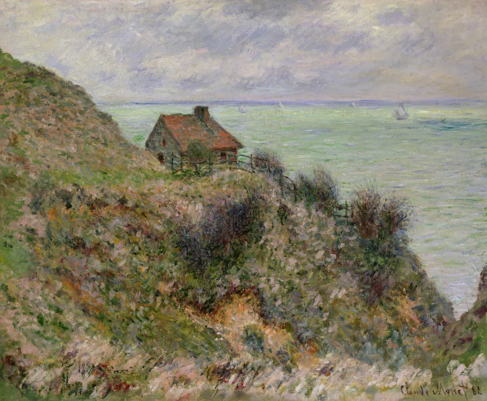 A small red-roofed stone hut high on a steep slope of heather and scrub, a calm gray-green sea with white sails beyond — Claude Monet, The Fisherman's House, Overcast Weather, 1882