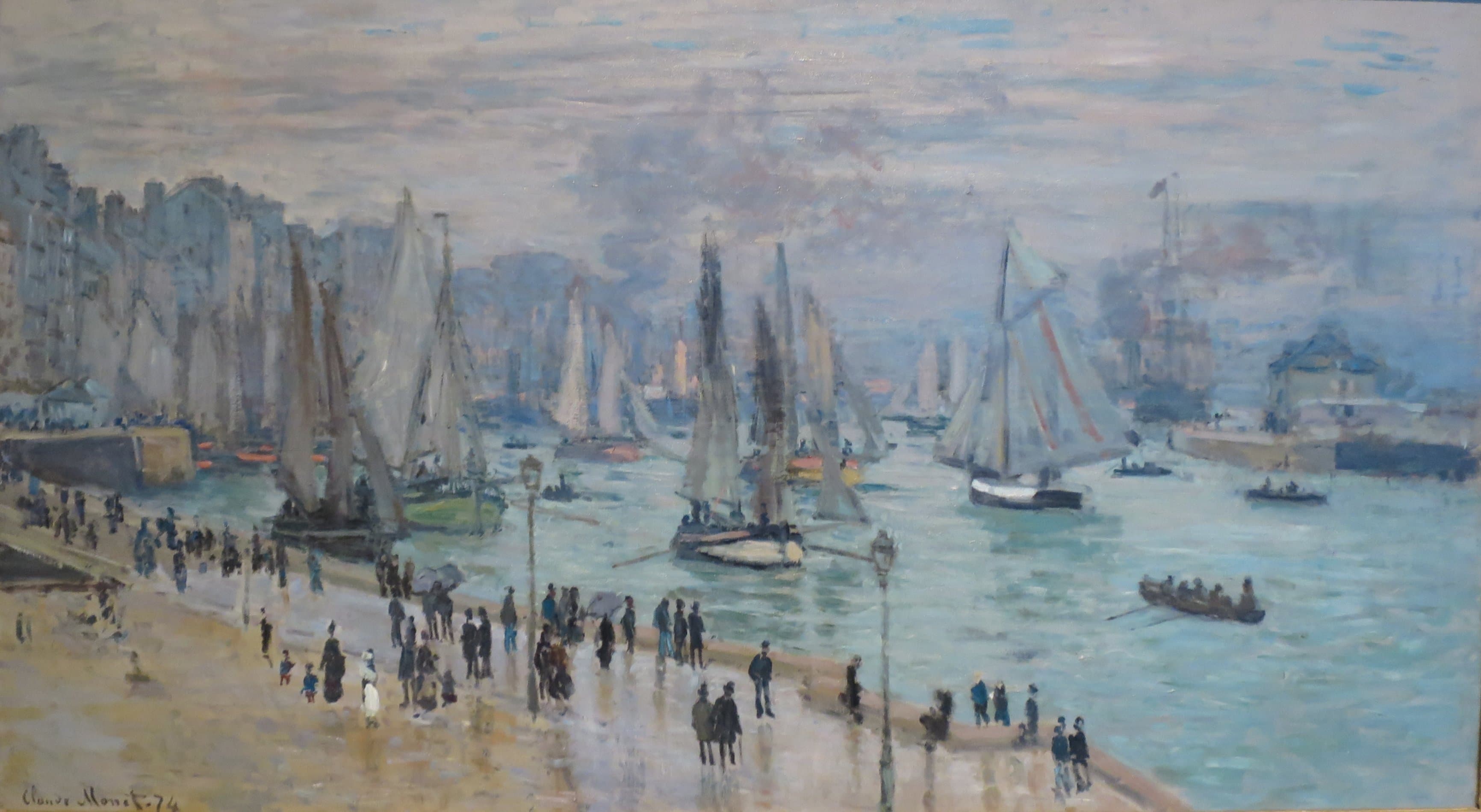 Fishing boats with pale sails crowd a harbor channel while people with umbrellas walk along a wet curving quay under a clearing sky — Claude Monet, Fishing Boats Leaving the Harbor, Le Havre, 1874