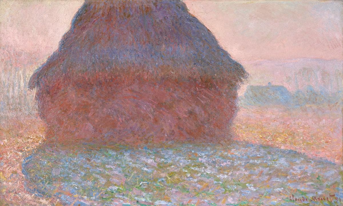 A huge grain stack, cut off at the top, glows red and violet in a hazy pink summer light, a long blue shadow across the field and farm buildings faint at right — Claude Monet, Grainstack in Sunlight, 1891