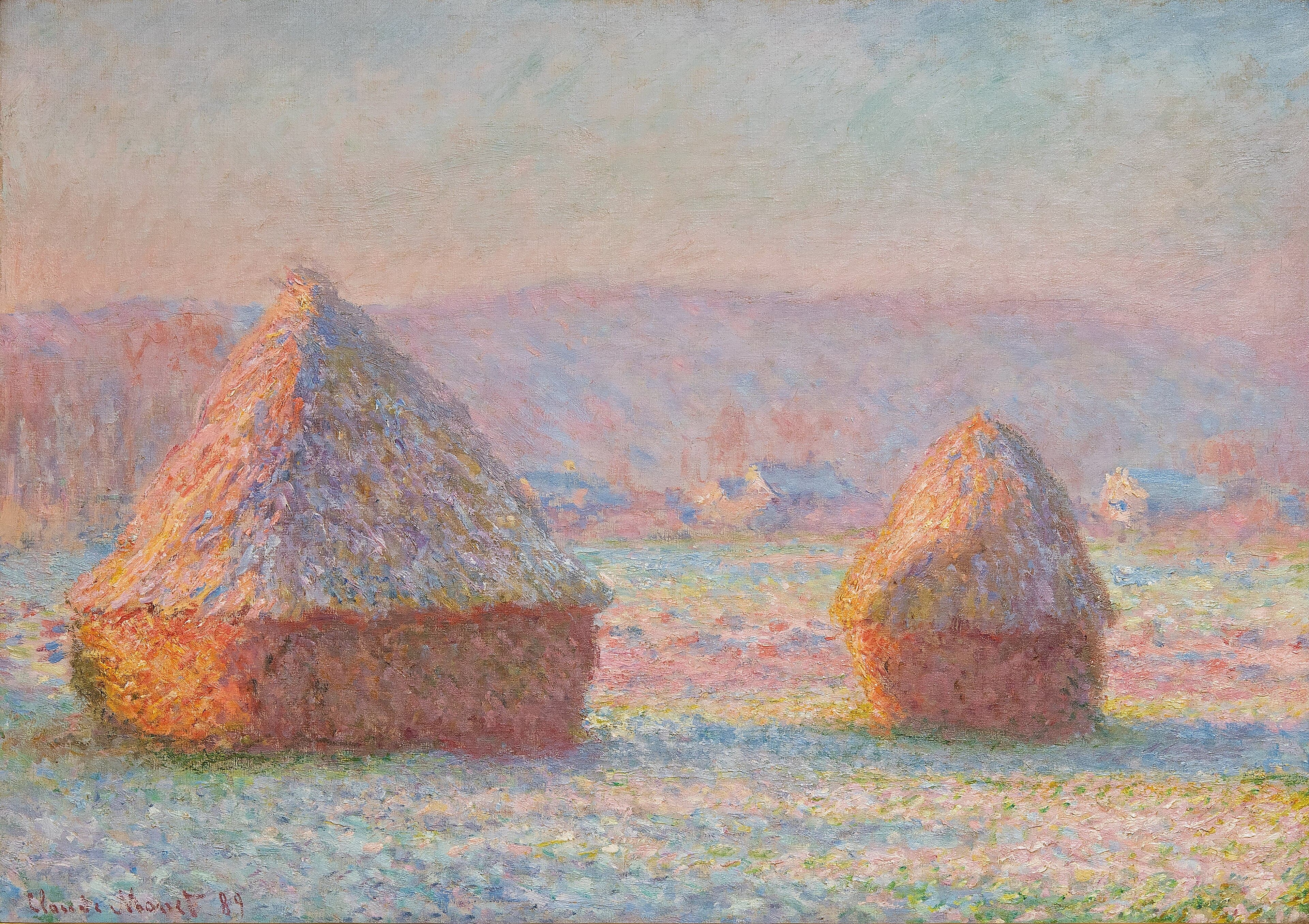 Two grainstacks with frosted roofs and sunlit orange-pink sides stand in a glittering white field before rose-colored hills — Claude Monet, Grainstacks, White Frost Effect, 1888–89