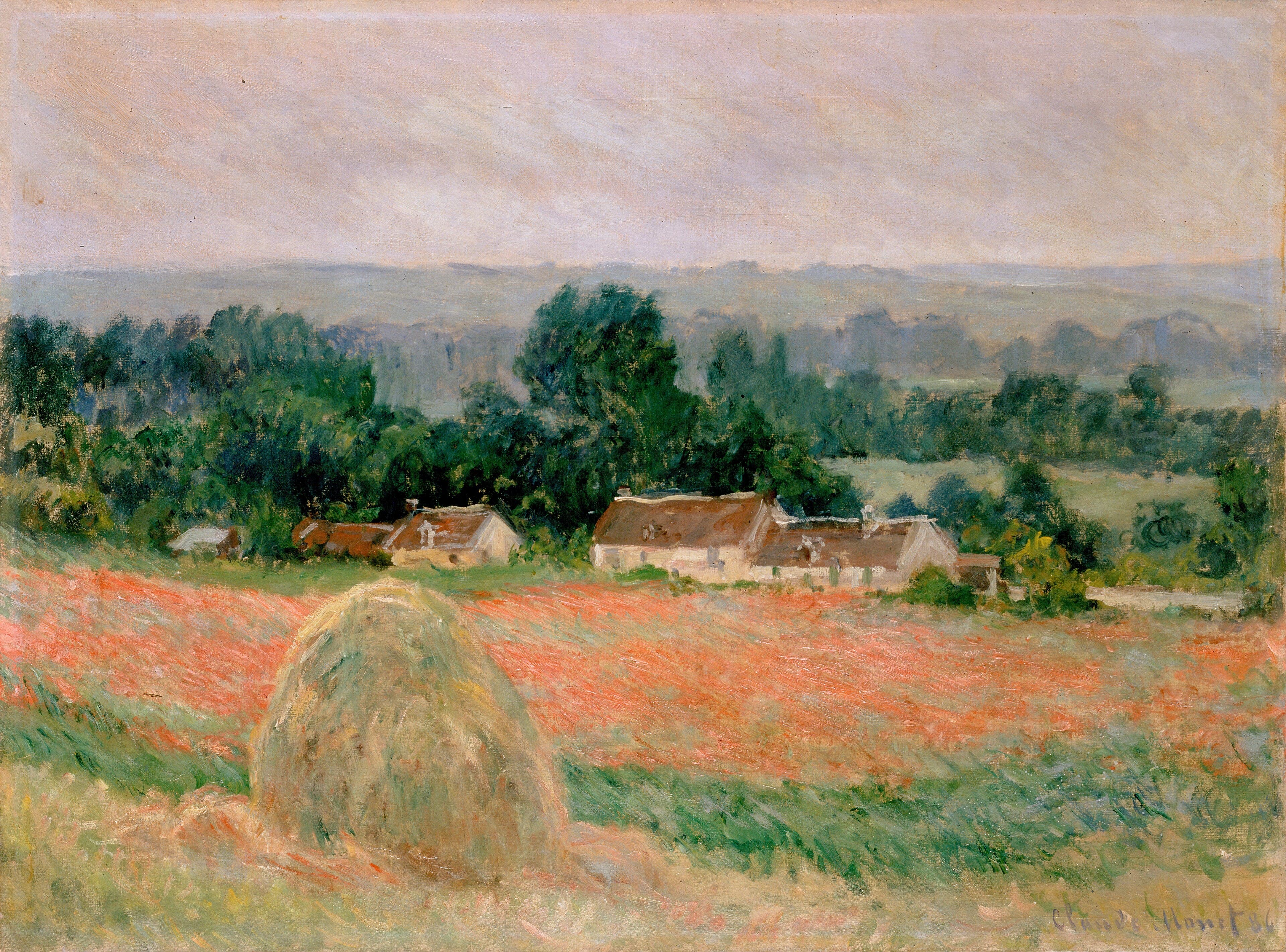A single golden haystack stands at the edge of a red-flecked field before a row of farmhouses among trees, with a hazy valley and pale sky behind — Claude Monet, Haystack at Giverny, 1886