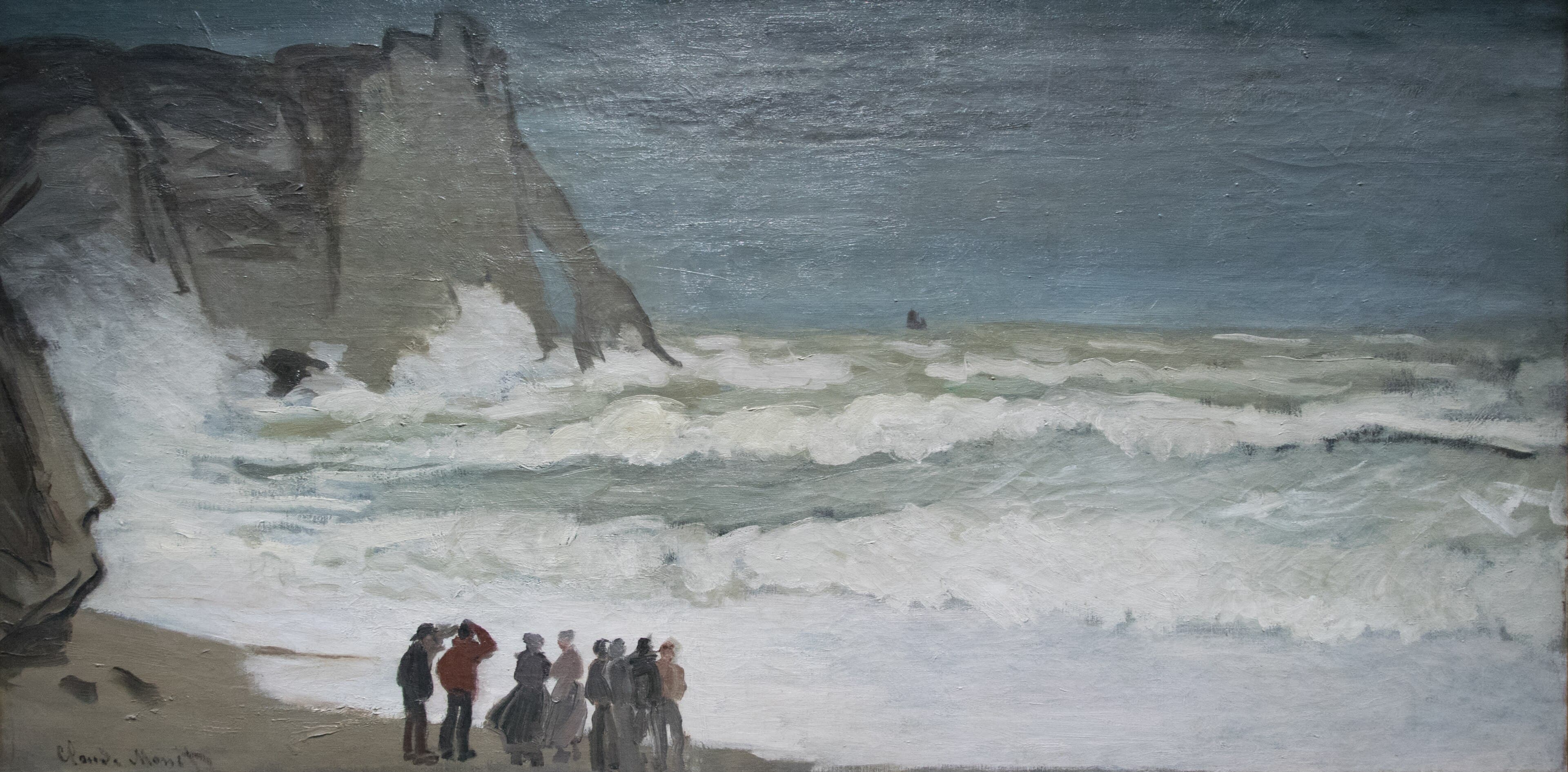 Rows of foaming gray-green breakers roll onto a beach under a dark rock arch and a low gray sky, watched by a small group of fishermen — Claude Monet, Heavy Sea at Étretat, c. 1868–69