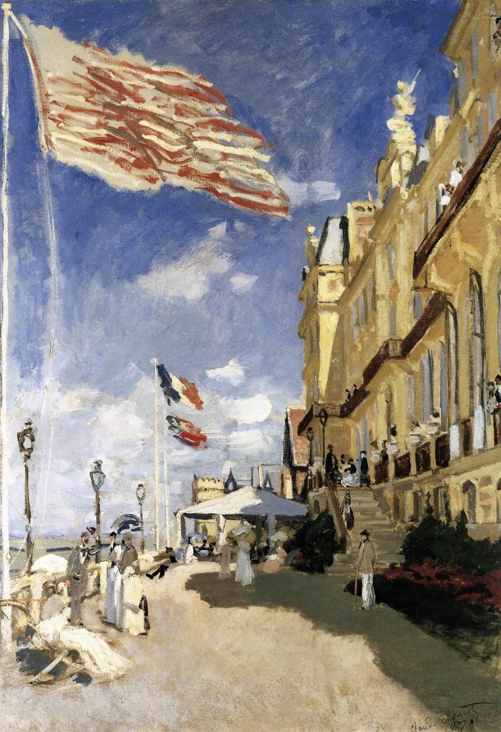 A sunlit grand hotel facade on the right, holidaymakers on the boardwalk below and a large striped flag streaming across a blue sky — Claude Monet, The Hôtel des Roches Noires, Trouville, 1870