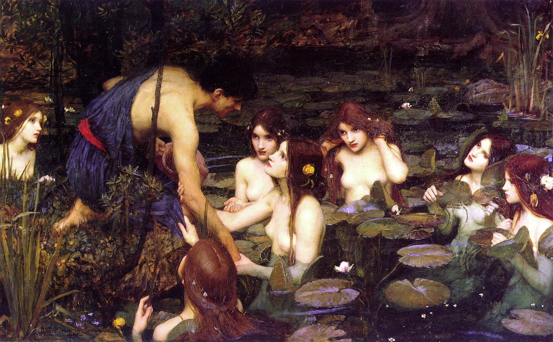 A young man in a blue tunic leans over a dark lily pond as seven pale, red-haired nymphs rise from the water and take his arm — John William Waterhouse, Hylas and the Nymphs, 1896