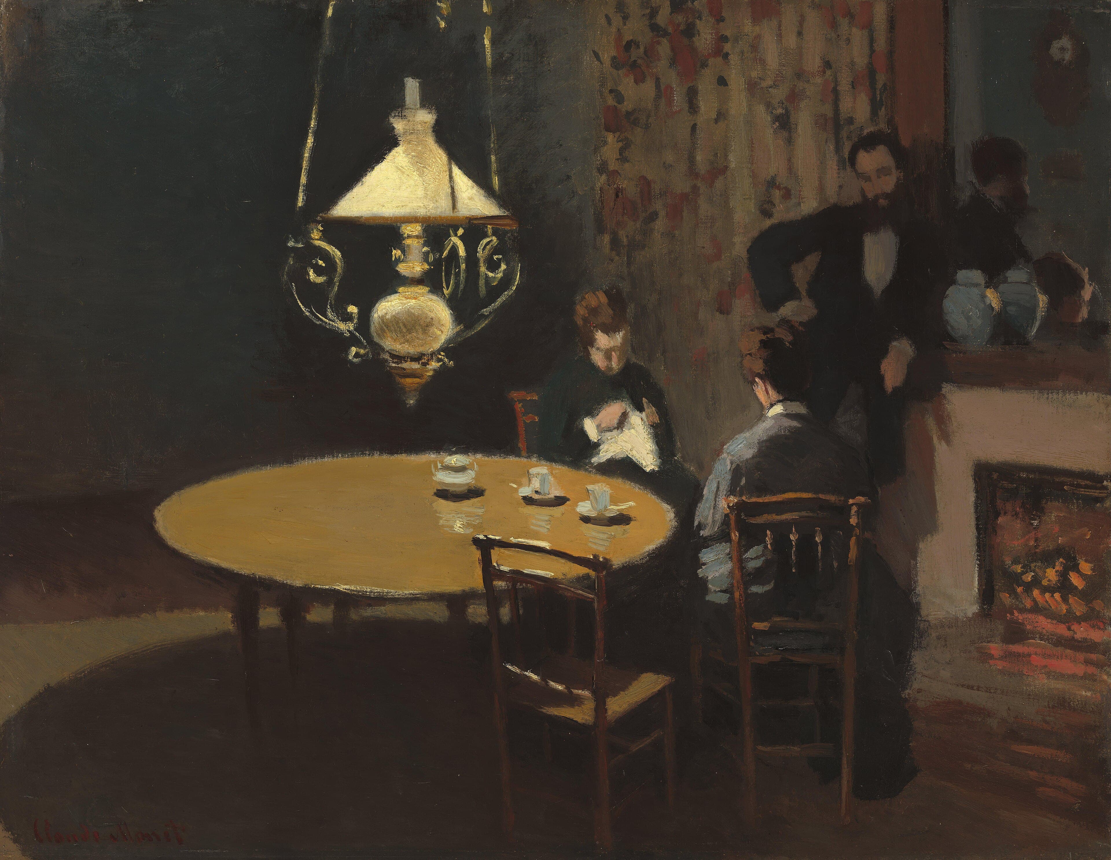 Two women sit at a round table under a hanging oil lamp while a bearded man leans on a mantel beside a red fire in a dark room — Claude Monet, Interior, after Dinner, 1868–69