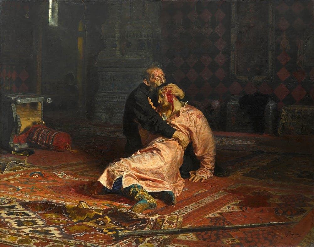An old man in black kneels on a red carpet clutching a young man in a pink robe whose head is bleeding, a staff lying on the floor in front of them — Ilya Repin, Ivan the Terrible and His Son Ivan, 1883–85