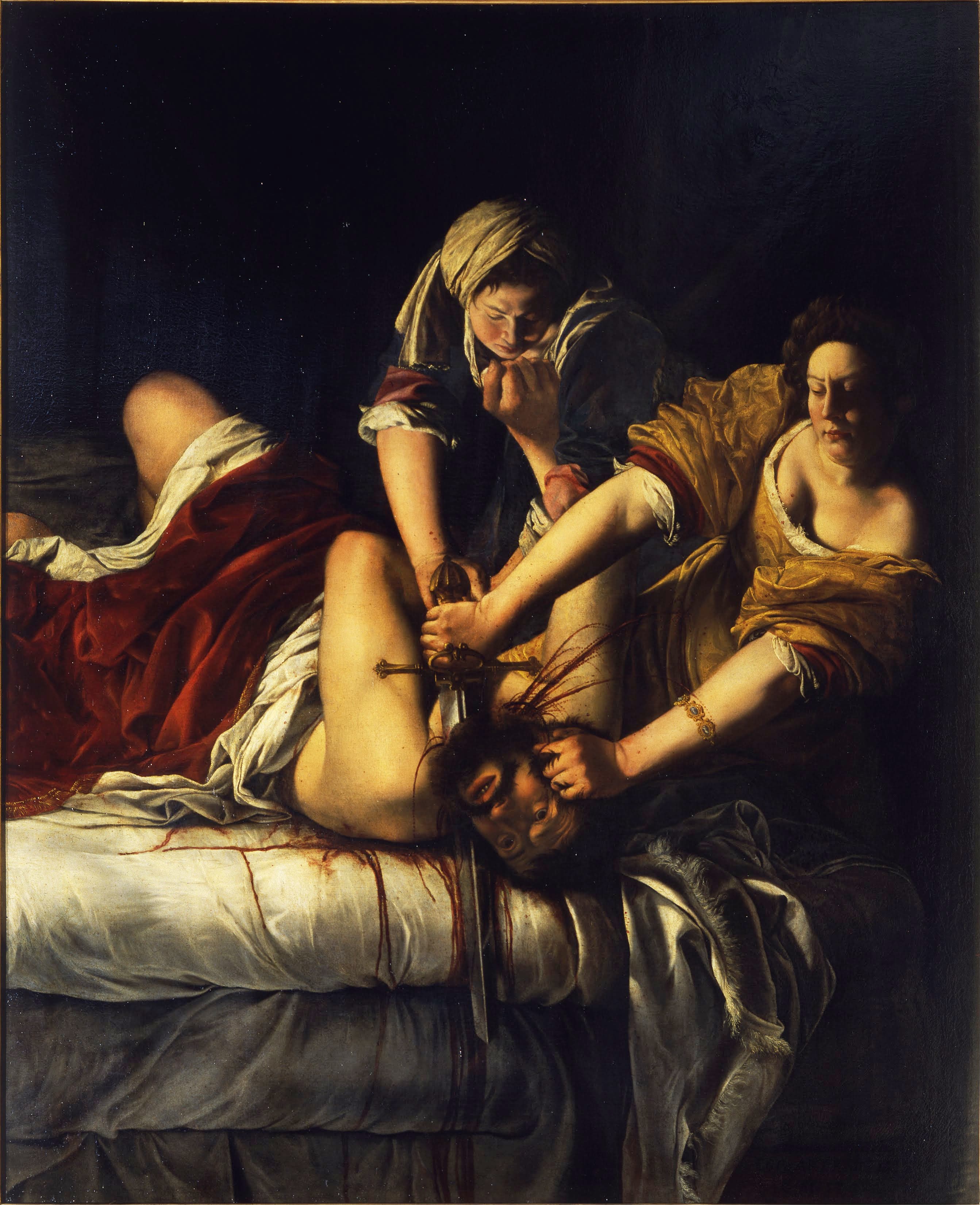 Two women hold a bearded man down on a bed as one, in a gold dress, drives a sword through his neck and blood runs down the white sheets — Artemisia Gentileschi, Judith Slaying Holofernes, c. 1620