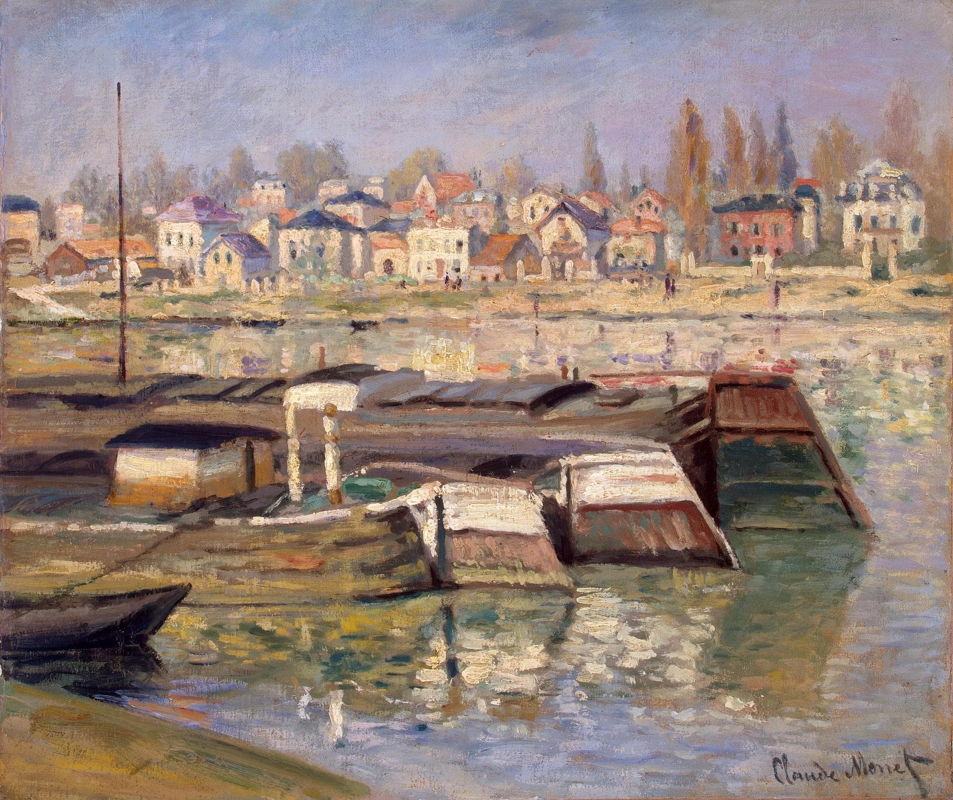 Flat-roofed barges moored in the foreground of a river, with sunlit houses and tall poplars on the far bank — Claude Monet, The Seine at Asnières, 1873
