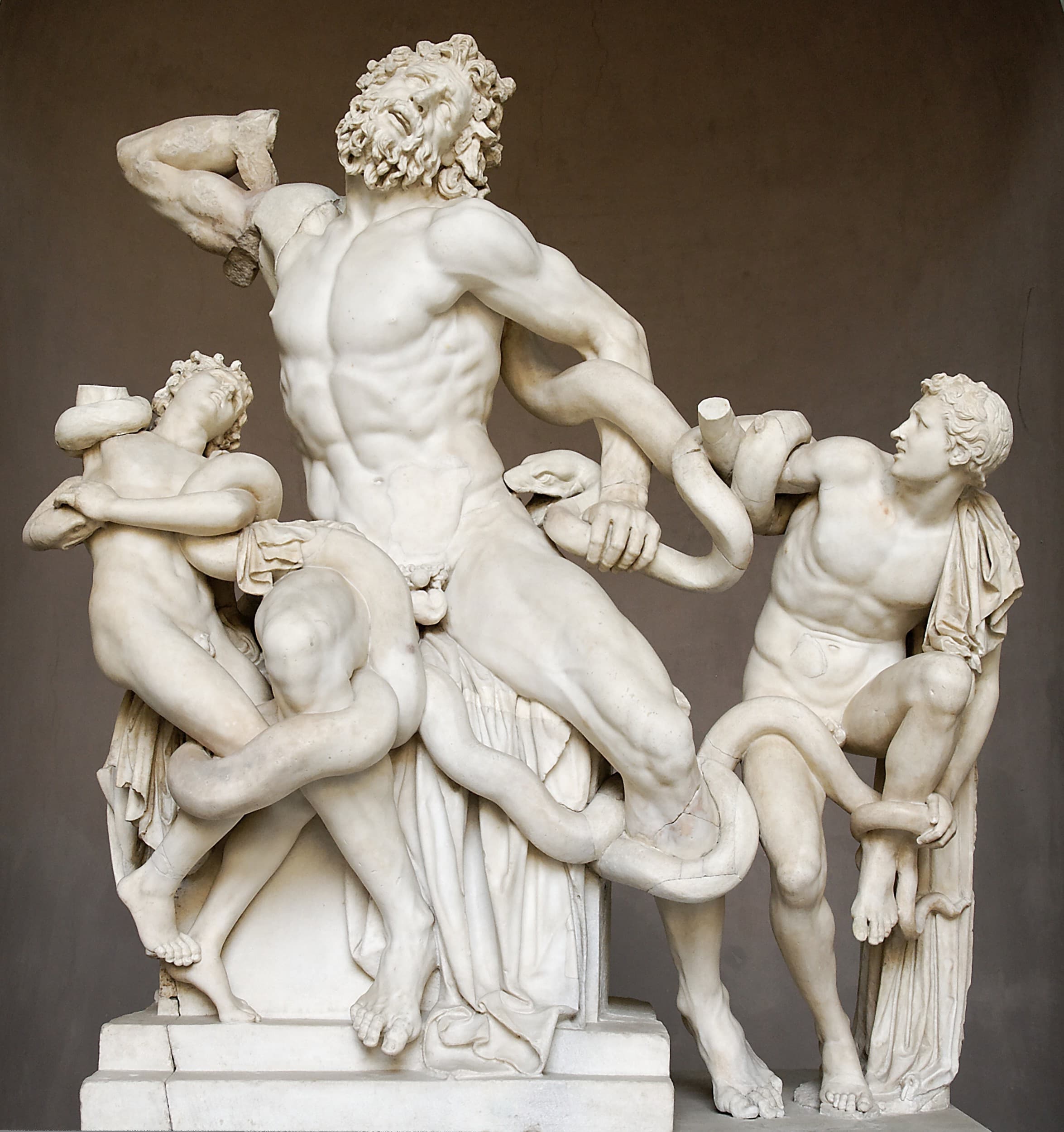 A muscular bearded man and two youths writhe in agony as giant serpents coil around and bite them — Agesander, Athenodoros and Polydorus, Laocoön and His Sons, Vatican Museums