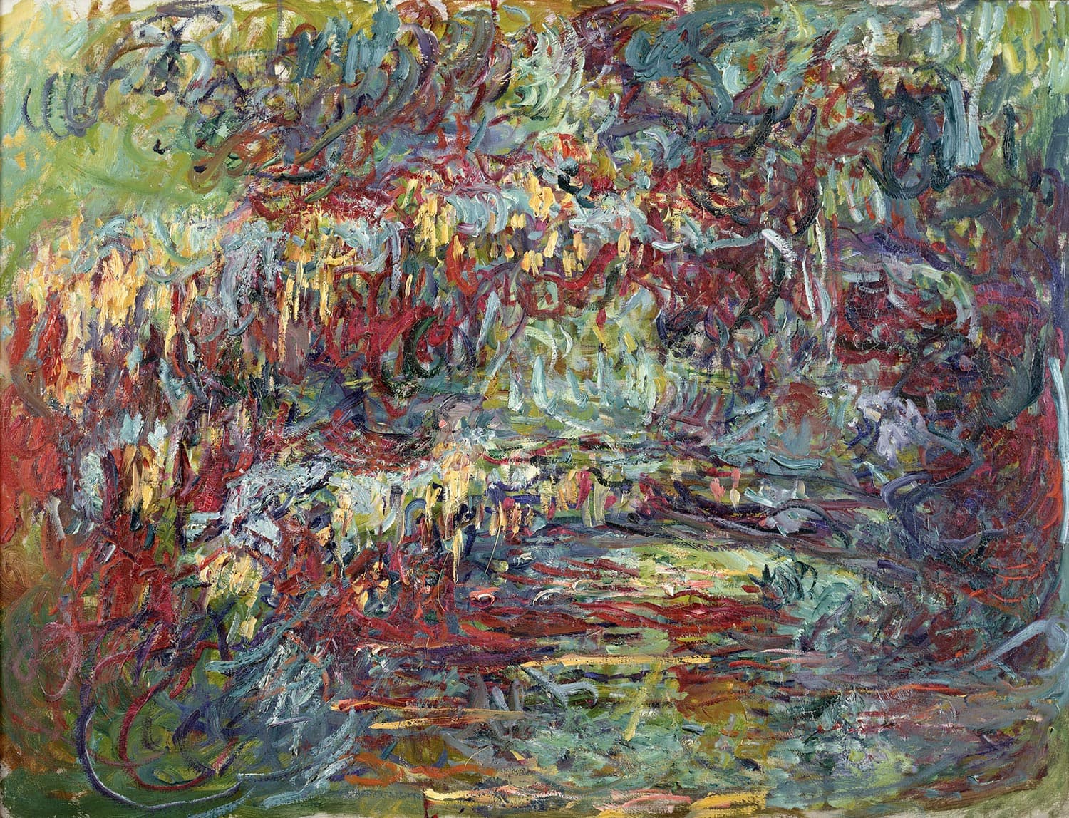 A faint arch crosses a tangle of looping red, turquoise and yellow strokes, with clusters of hanging yellow marks like wisteria blossom — Claude Monet, Le Pont japonais, c. 1918–24