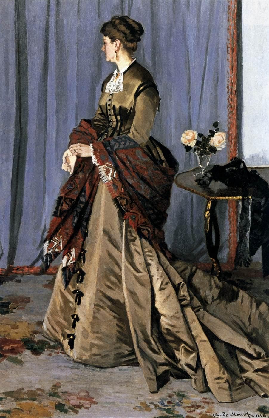 A woman in profile in a long olive silk gown with a train and a red cashmere shawl stands by a table of roses before a blue-violet curtain — Claude Monet, Madame Louis Joachim Gaudibert, 1868