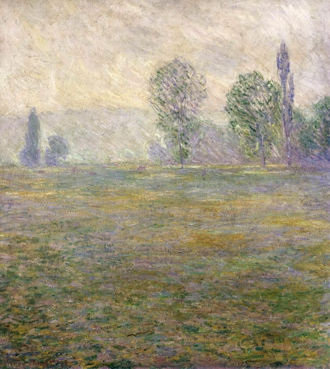 A wide meadow of green, ochre and lilac strokes stretches beneath a hazy pale-yellow sky, with leafy trees and a slender poplar in the mist — Claude Monet, Meadow at Giverny, 1888