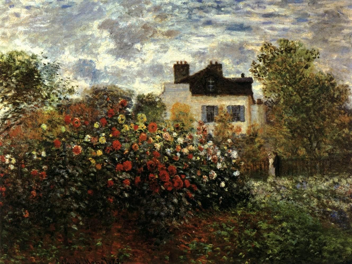 A tall bank of red, yellow and white dahlias in front of a pale house with a dark roof and chimneys, a couple by a fence, under a cloudy sky — Claude Monet, The Artist's Garden in Argenteuil (A Corner of the Garden with Dahlias), 1873