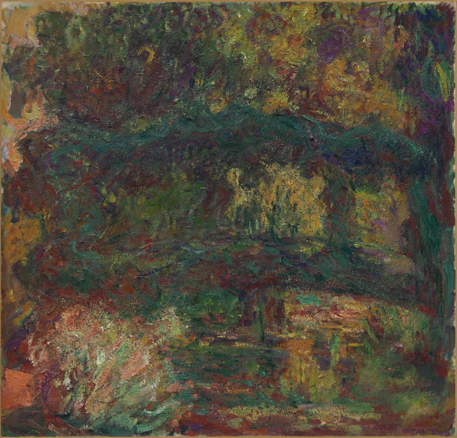 A dark green arch of footbridge crosses a shadowy pond under dense foliage in thick strokes of green, red and ocher — Claude Monet, Nymphéas, Japanese Bridge, 1918–26