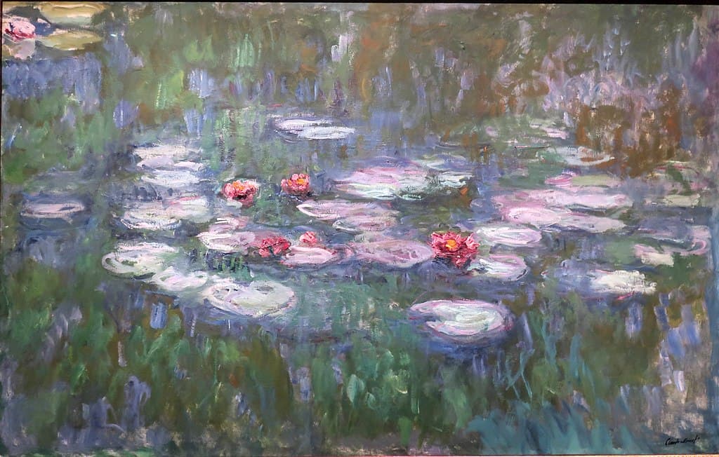 Pale pink lily pads and deep rose water lilies float on water streaked with vertical blue, violet and green reflections, with no bank or sky — Claude Monet, Nymphéas (Water Lilies), 1910s