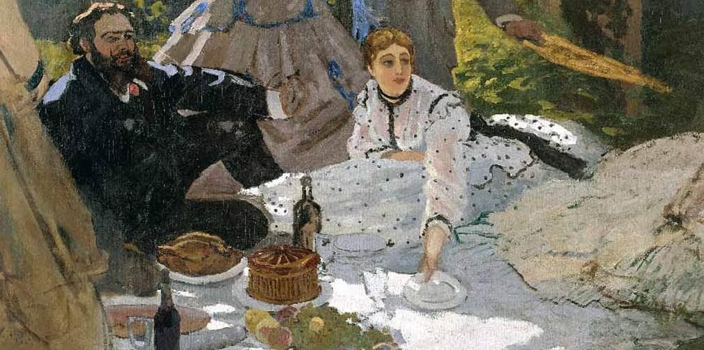 A young woman in a white polka-dot dress sits by a picnic cloth laid with a raised pie, roast fowl, wine and fruit, beside a reclining bearded man in a dark jacket — Claude Monet, Le Déjeuner sur l'herbe (detail), 1865–66