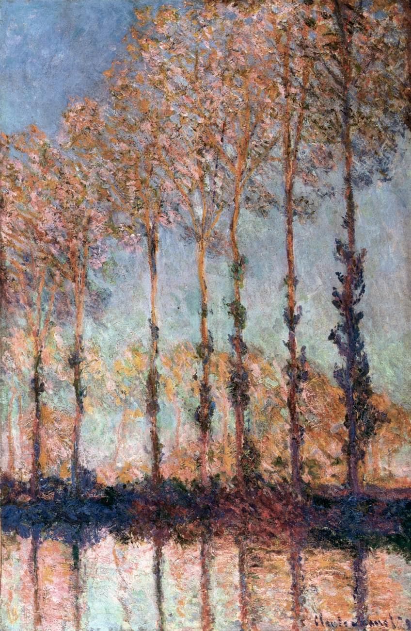 A row of tall, slender poplars with rose and orange autumn leaves stands along a riverbank, reflected in violet and pink water below a pale sky — Claude Monet, Poplars on the Banks of the River Epte, 1891