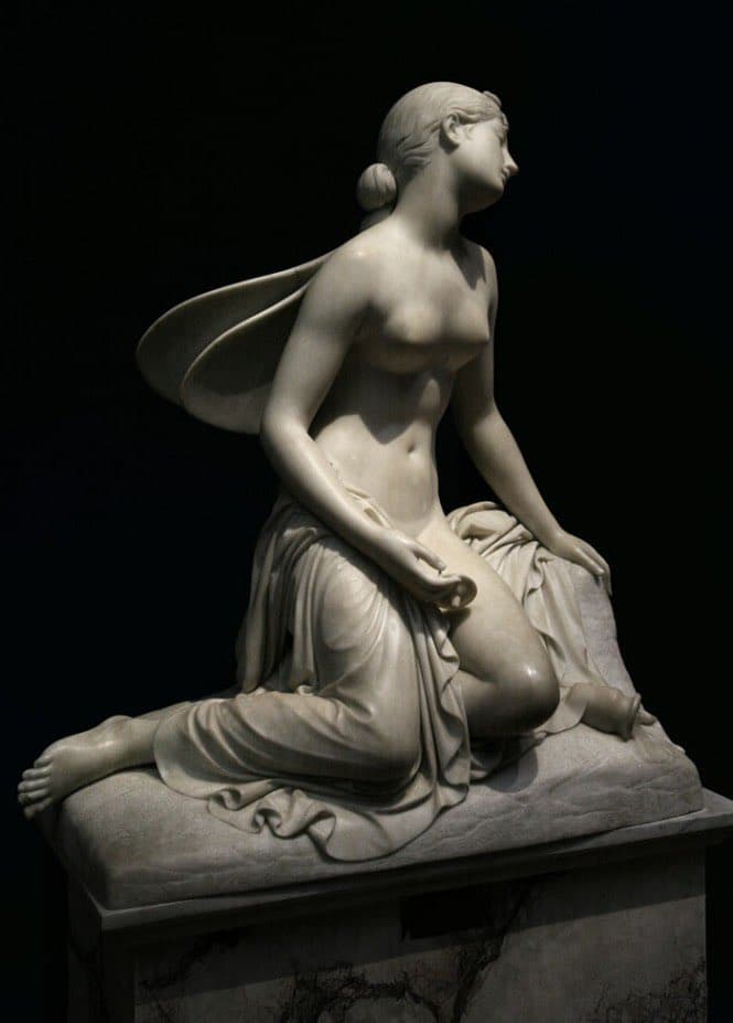 A winged young woman kneels on draped rock, head thrown back in a swoon, an overturned vessel by her knee — Pietro Tenerani, Psyche in a Faint, marble
