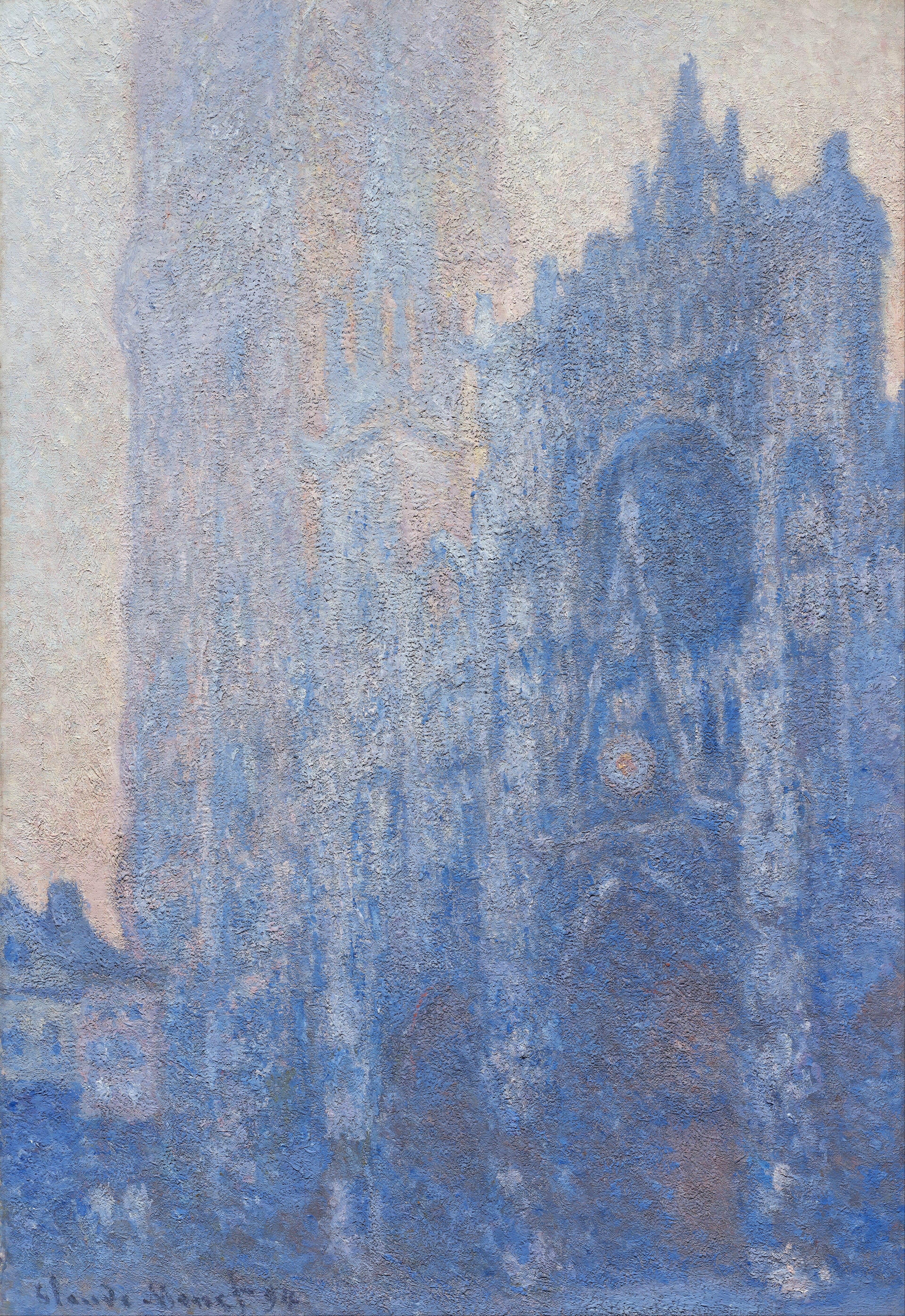 The façade and tall tower of Rouen Cathedral seen at an angle in deep blue shadow against a pale cream and pink dawn sky — Claude Monet, Rouen Cathedral Façade and Tour d'Albane (Morning Effect), 1893–94