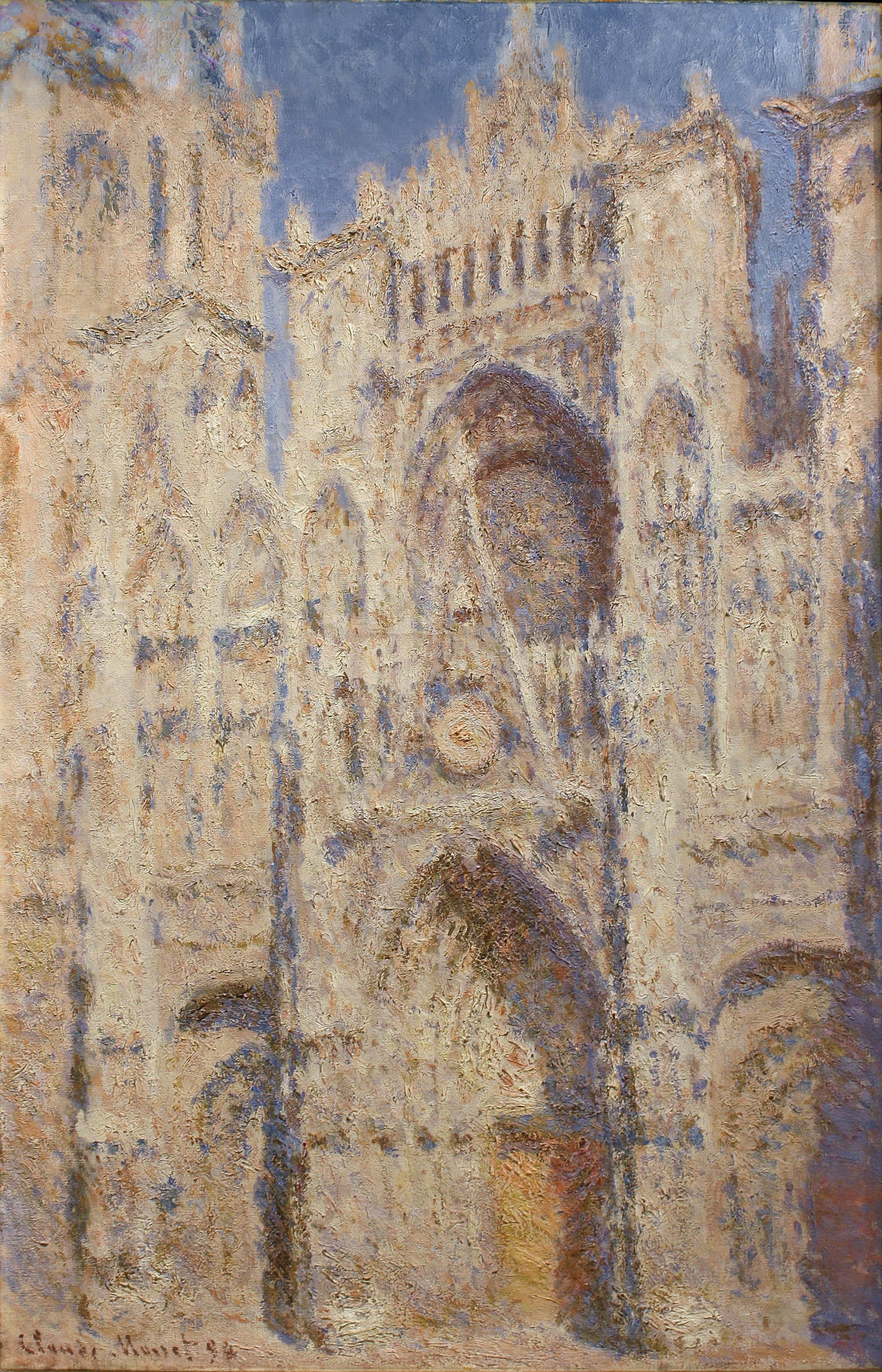 The sunlit Gothic portal of Rouen Cathedral in cream and apricot with blue-violet shadows under a deep blue sky, the central door glowing orange — Claude Monet, Rouen Cathedral: The Portal (Sunlight), 1892–94