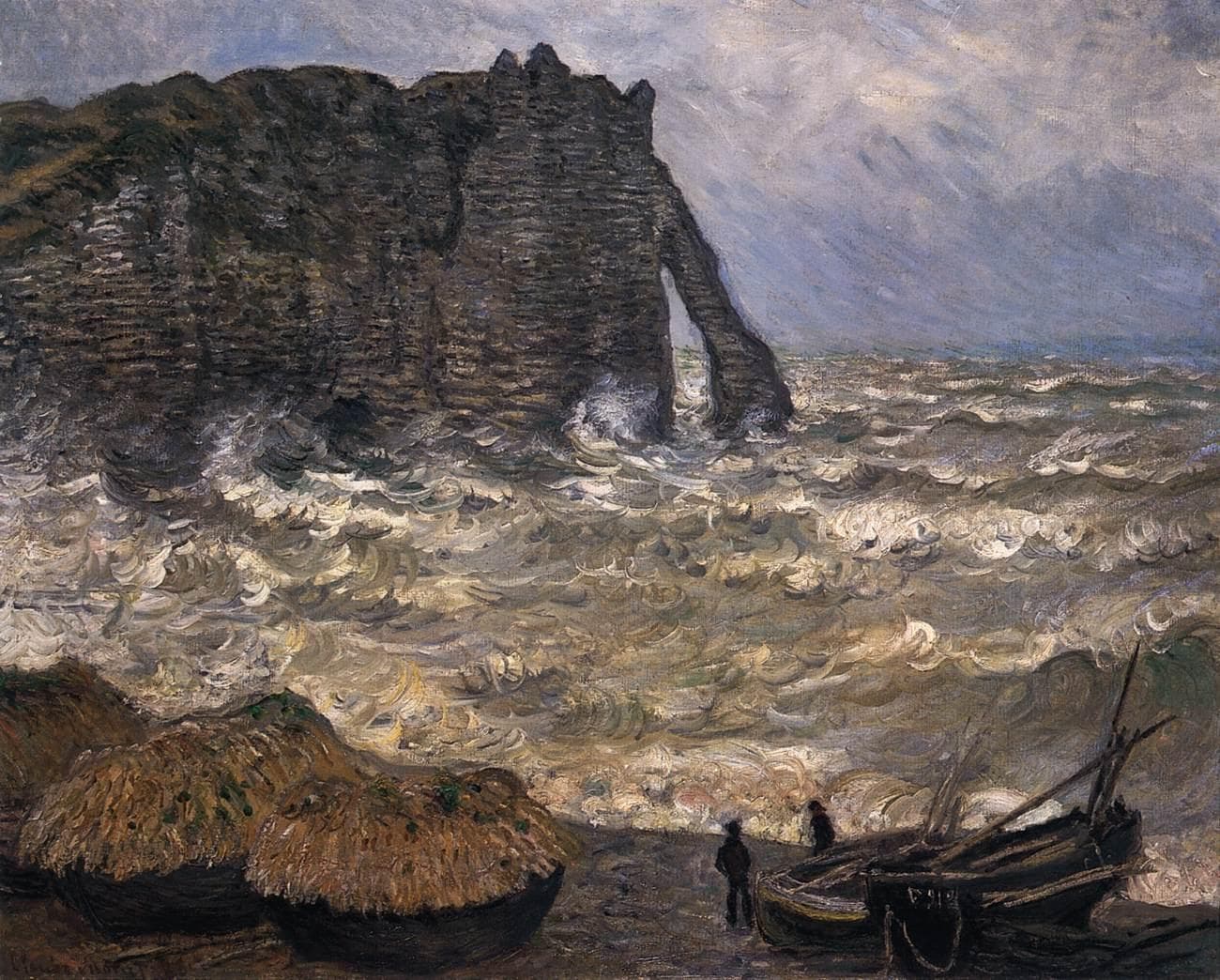 Storm waves crash beneath a dark cliff and its arch while two fishermen stand between beached boats and thatched boat-sheds on the shingle — Claude Monet, Rough Sea at Étretat, 1883