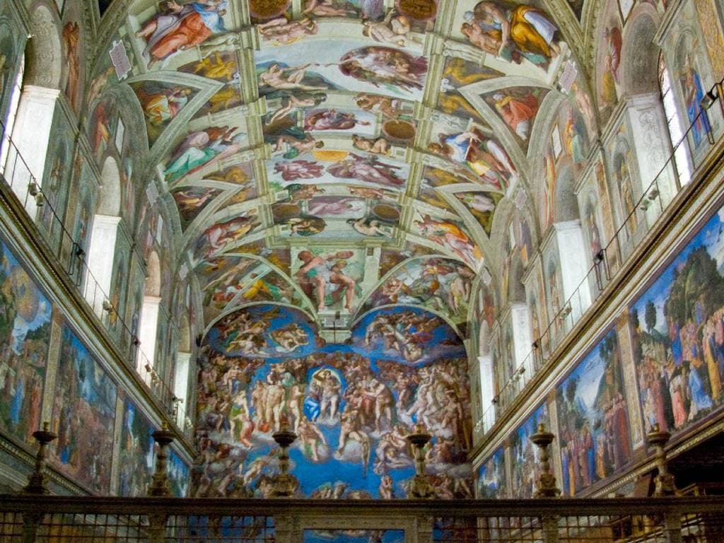 The interior of the Sistine Chapel, its long vault covered with frescoed Genesis scenes, prophets and nude figures, with the Last Judgment on the far wall — Michelangelo, Sistine Chapel ceiling, 1508–12