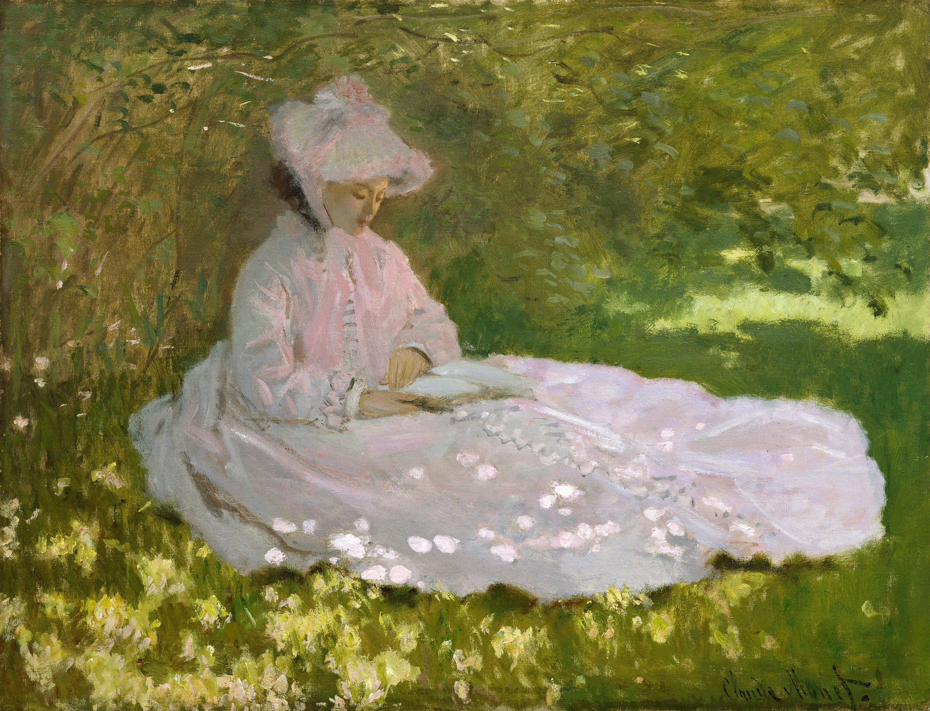A young woman in a pale pink dress and bonnet sits reading in the grass under trees, sunlight dappling her skirt — Claude Monet, Springtime, 1872