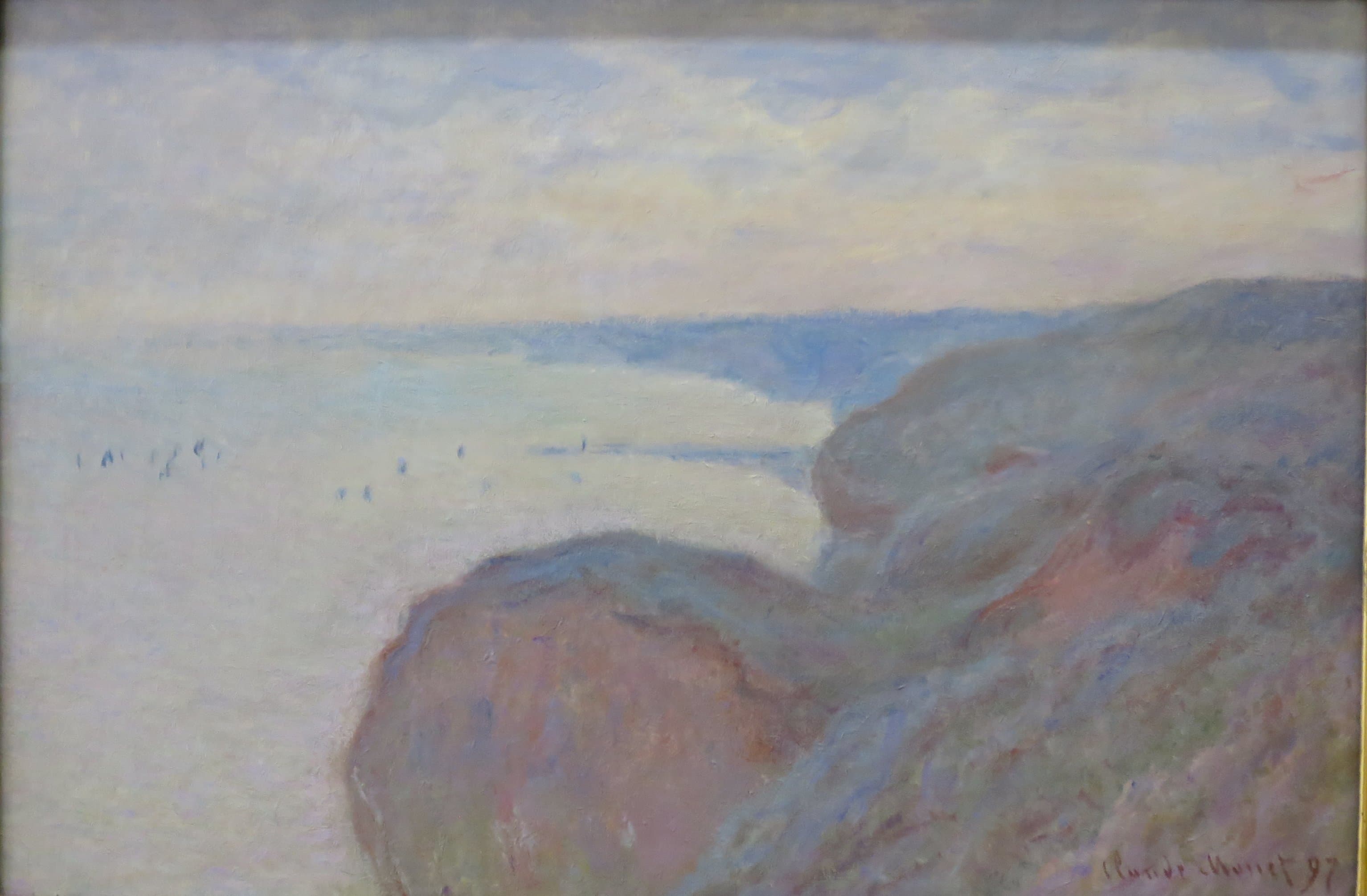 Rounded grassy cliffs in mauve and rose drop toward a pale, flat sea, headlands receding under an overcast sky — Claude Monet, Steep Cliffs near Dieppe, 1897