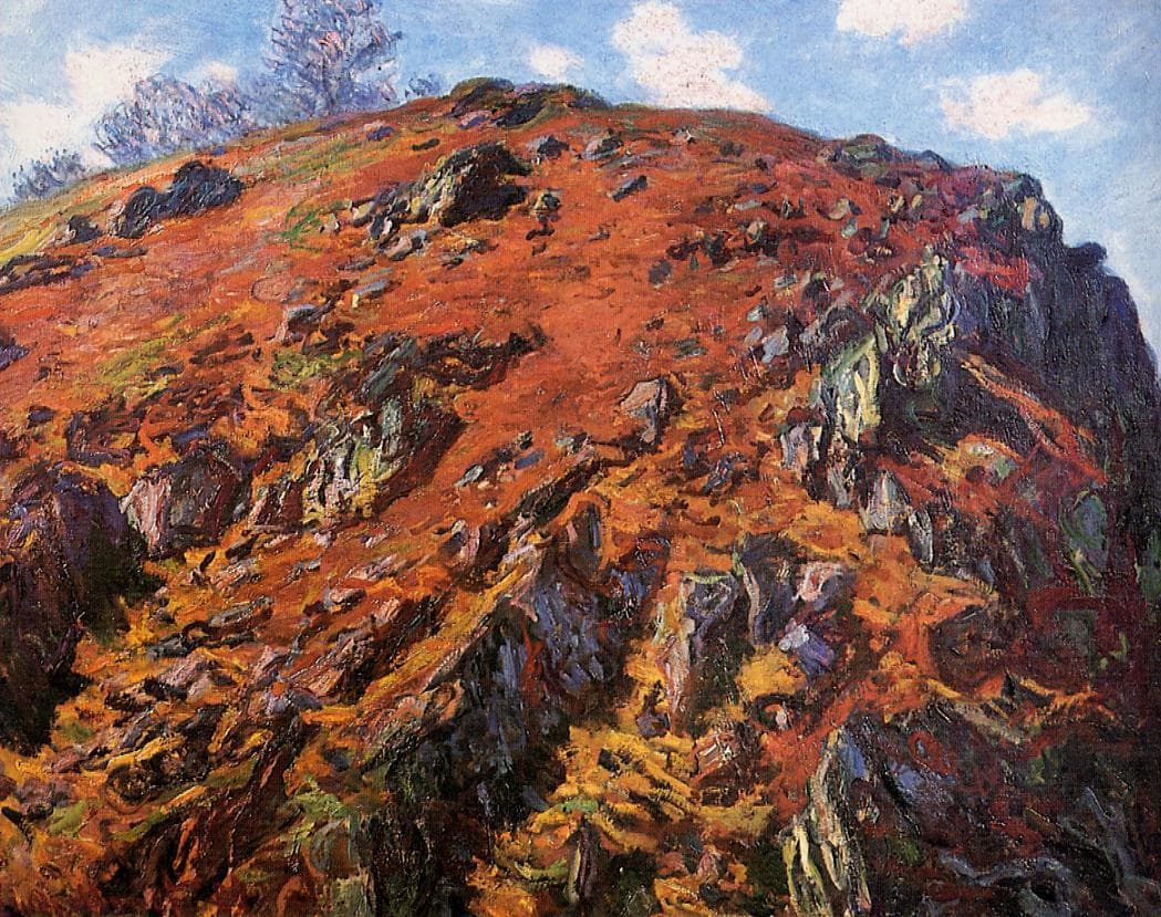 A massive rocky hillside covered in rust-red and orange heath with dark blue cliff faces, under a strip of blue sky — Claude Monet, Study of Rocks, Creuse, 1889