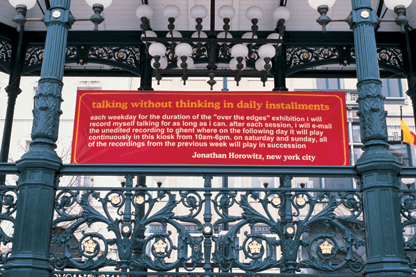 A red sign explaining a daily sound piece hangs inside an ornate cast-iron bandstand with globe lamps — Jonathan Horowitz, Talking Without Thinking, 2000