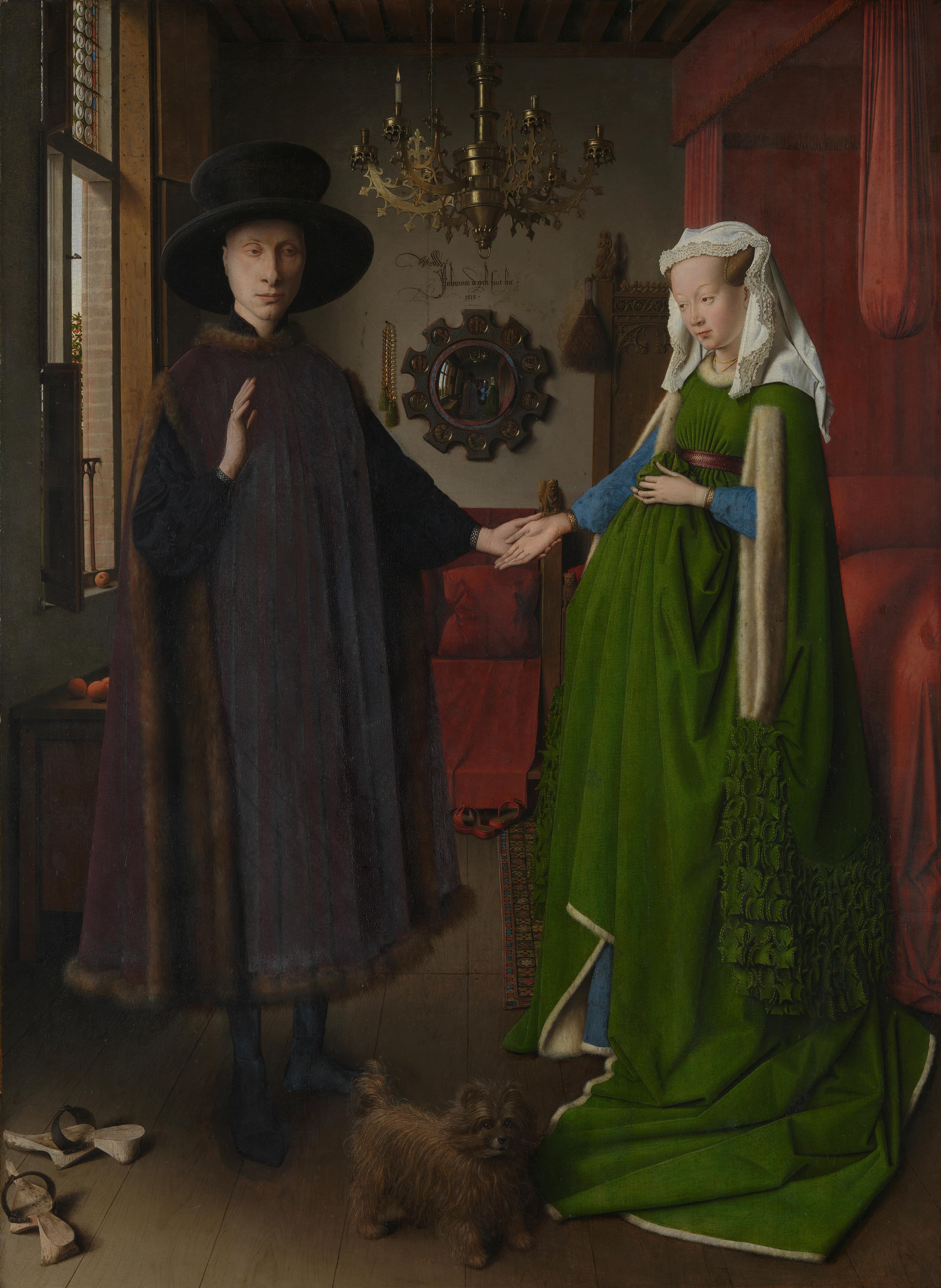 A man in a broad black hat holds the hand of a woman in a full green gown in a bedroom with a convex mirror, a brass chandelier and a small dog — Jan van Eyck, The Arnolfini Portrait, 1434