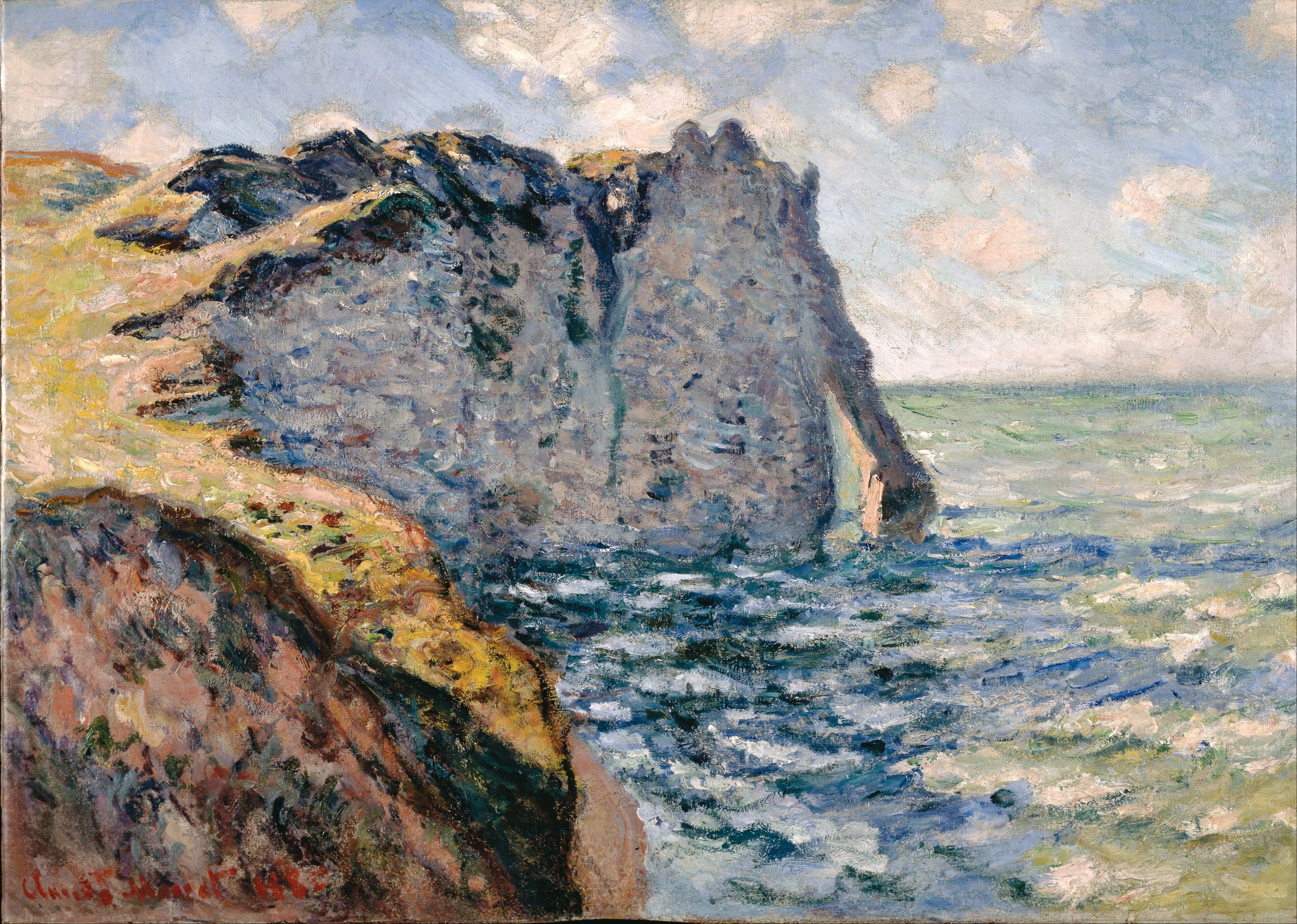 A gray-violet cliff with a narrow arch rises from a choppy blue-green sea, seen from a sunlit grassy slope at left under white clouds — Claude Monet, The Cliff of Aval, Étretat, 1885