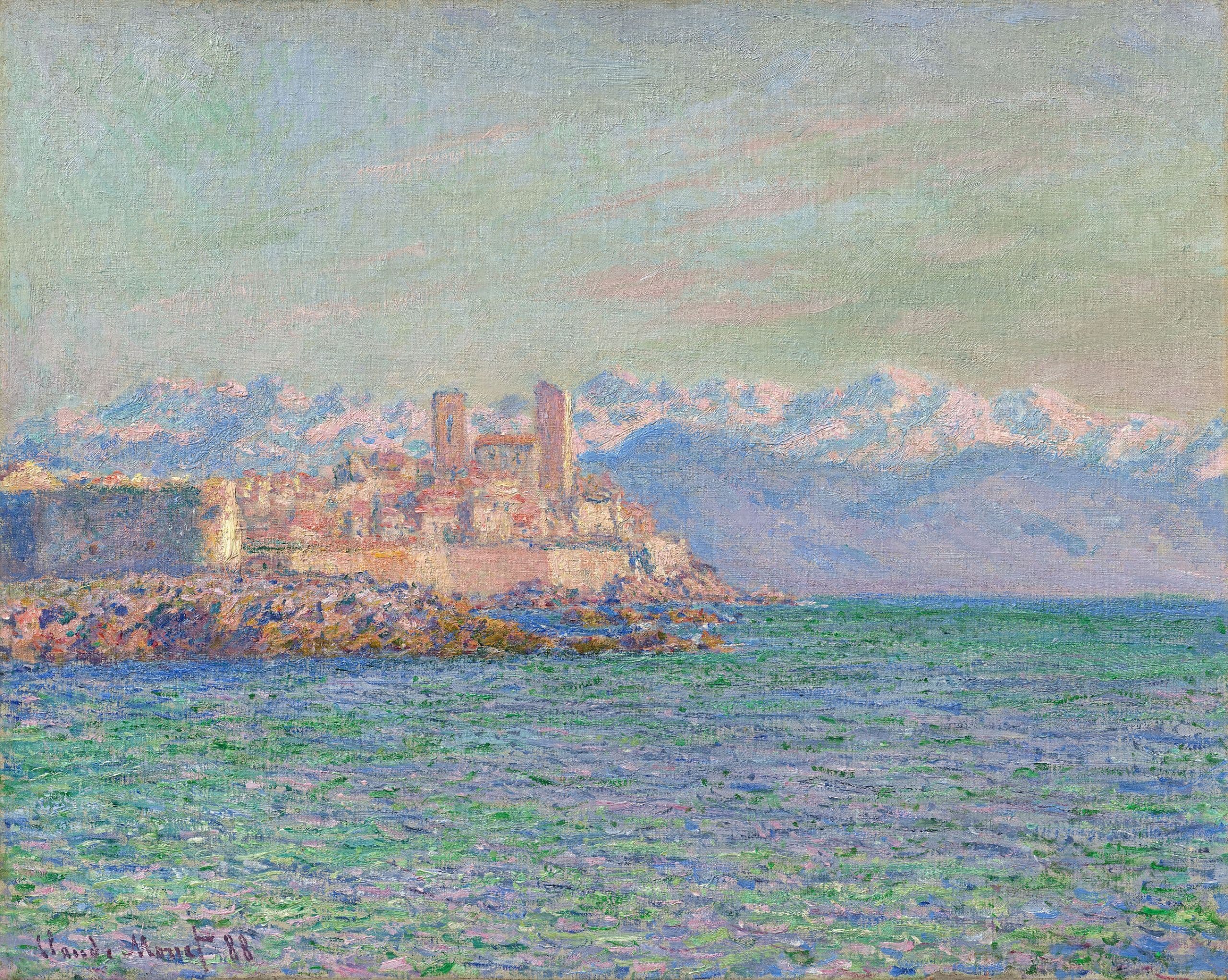 The walled old town of Antibes with two square towers glows pink and cream on a rocky spit between a shimmering turquoise sea and snow-capped mountains — Claude Monet, The Fort of Antibes, 1888