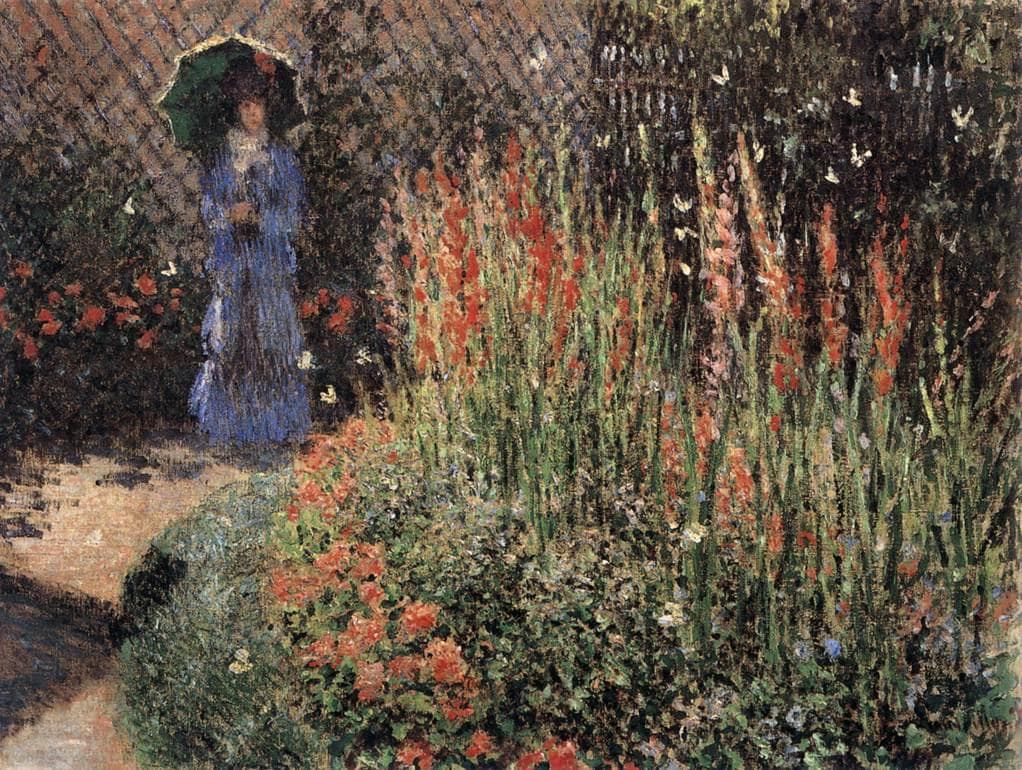 A curving bed of tall red gladioli and geraniums with a woman in blue under a green parasol on the path behind — Claude Monet, The Gladioli, c. 1876