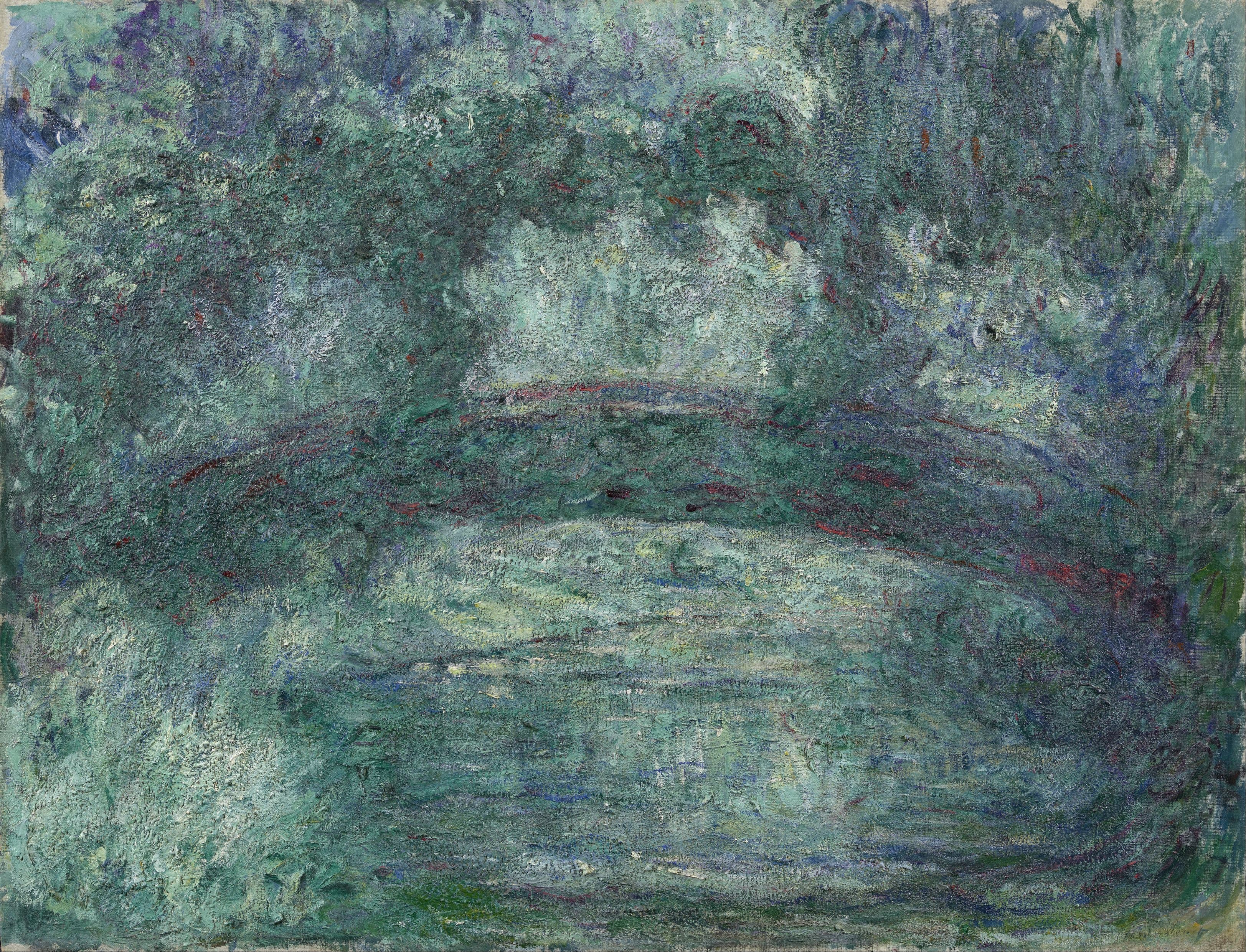 A wide gray-green arch flecked with red spans a pale glowing pond beneath crusty sage-green foliage — Claude Monet, The Japanese Bridge, 1919–24