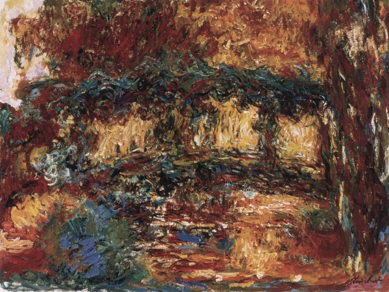 A low arched footbridge draped in foliage emerges from thick strokes of rust red, orange and dark green above a mottled pond — Claude Monet, The Japanese Bridge, c. 1918–24