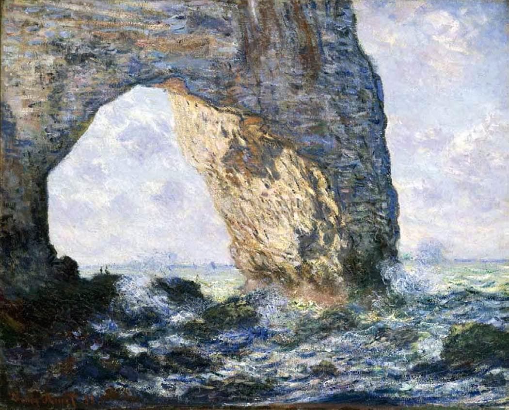 A massive rock arch fills the canvas, sunlit on its inner face, with surf breaking over rocks and sea and sky seen through the opening — Claude Monet, The Manneporte (Étretat), 1883