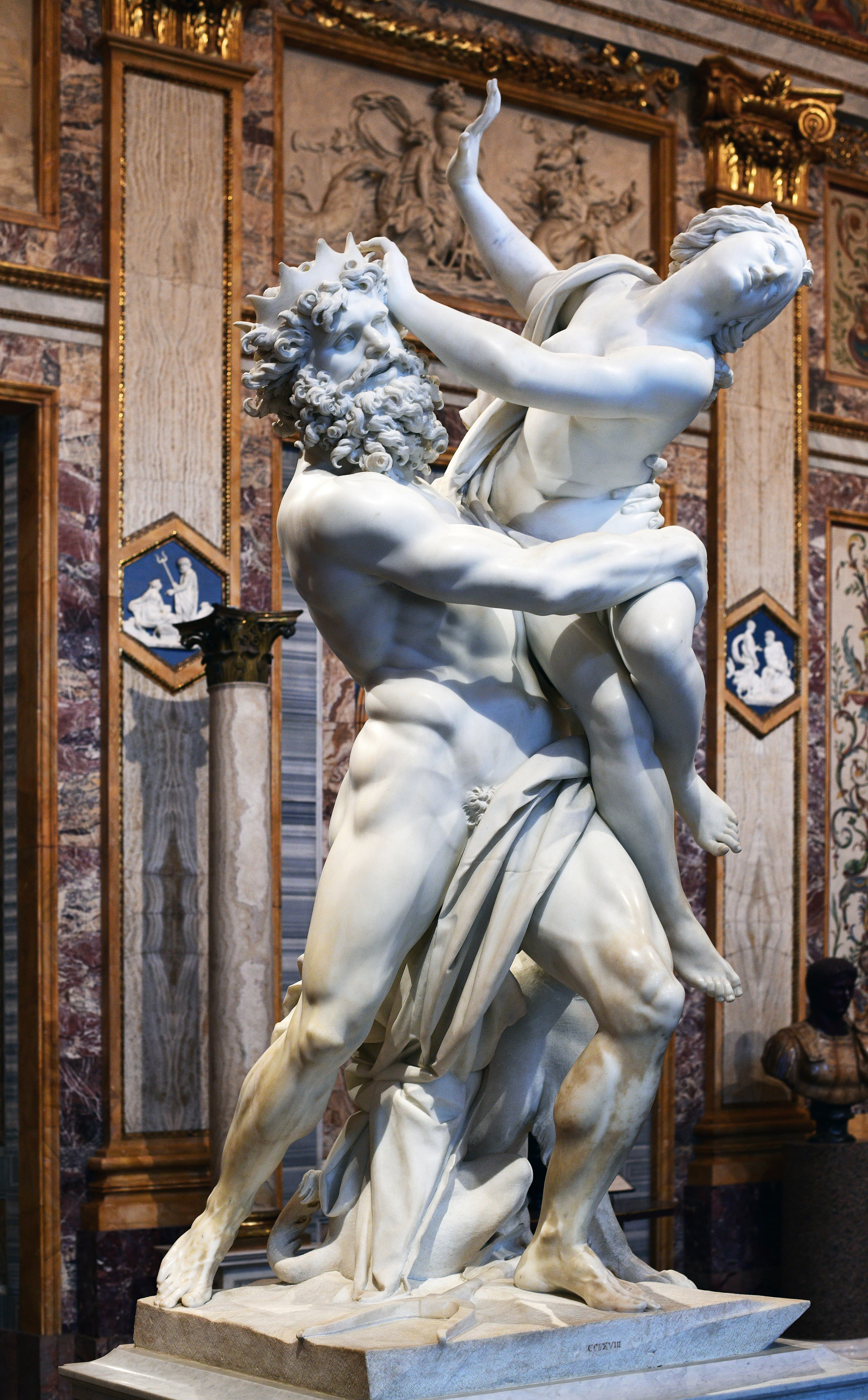 A bearded god lifts a struggling young woman, his fingers pressing into her marble thigh, as a three-headed dog snarls at his feet — Gian Lorenzo Bernini, The Rape of Proserpina, 1621–1622